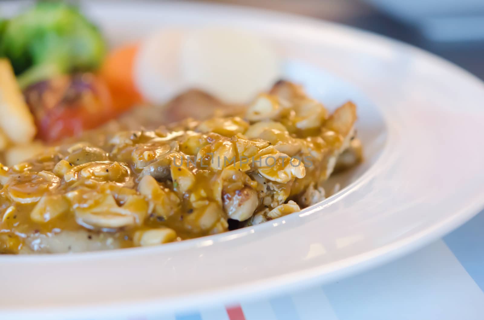 close up  beef steak with  mushroom sauce on white plate 