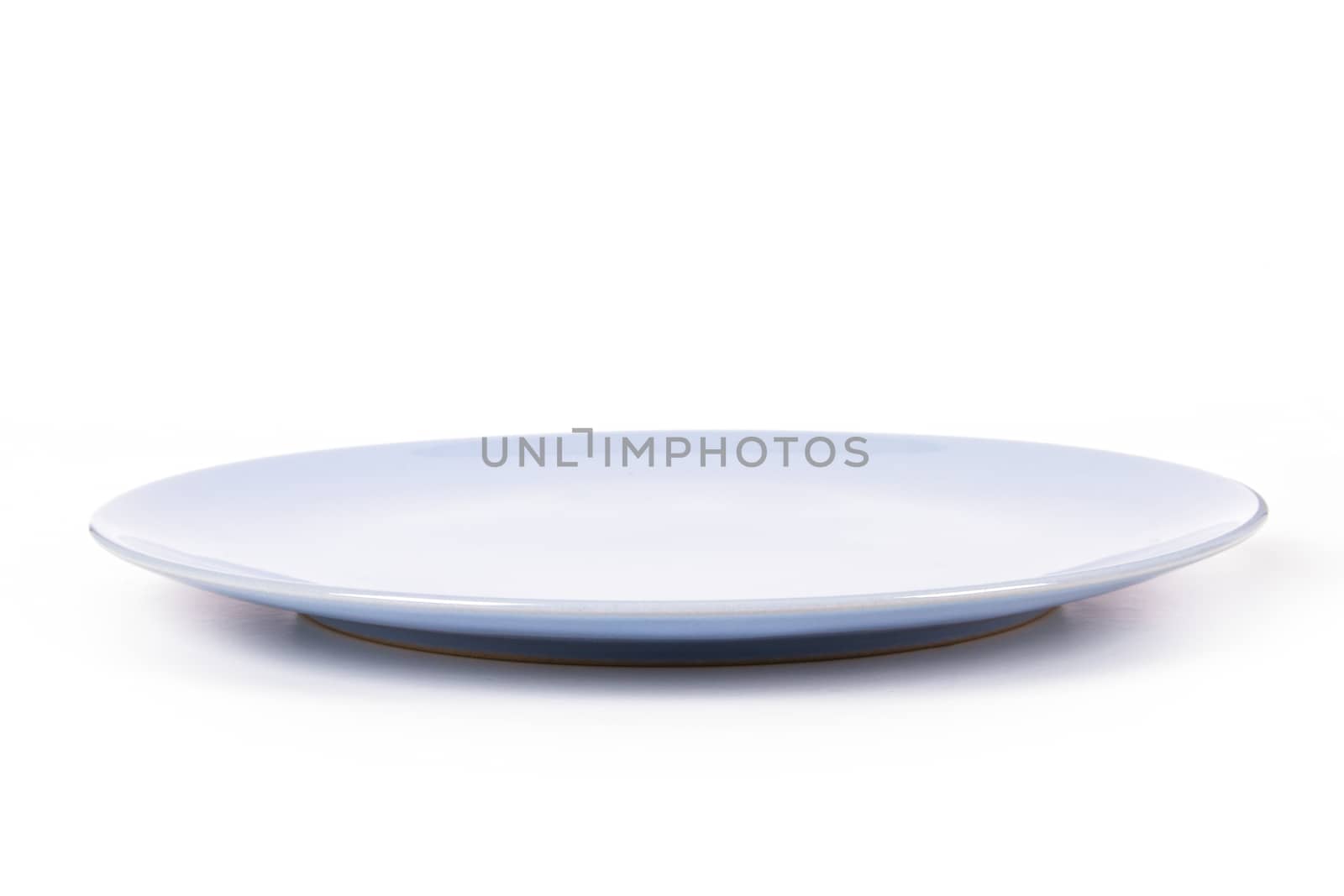 Blue, empty plate, side view, isolated on white background.