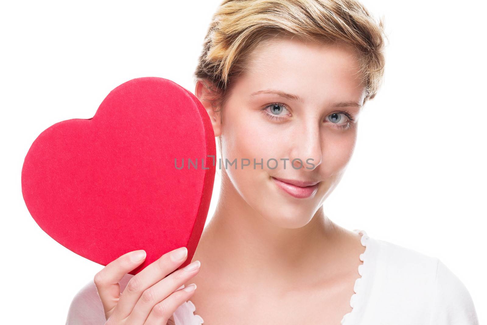 cute young woman holding red heart by RobStark