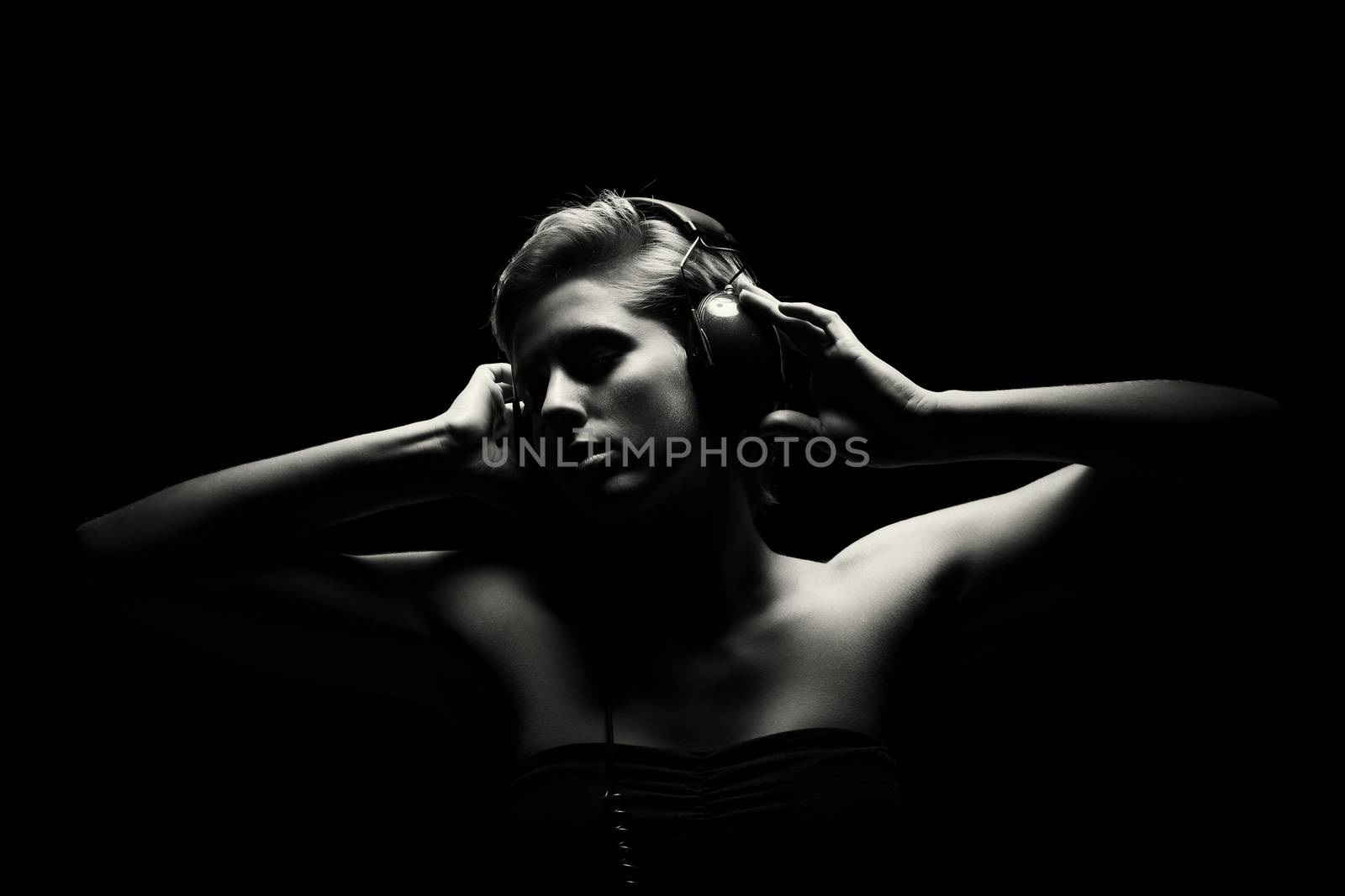 gorgeous woman in black and white listening to music by RobStark