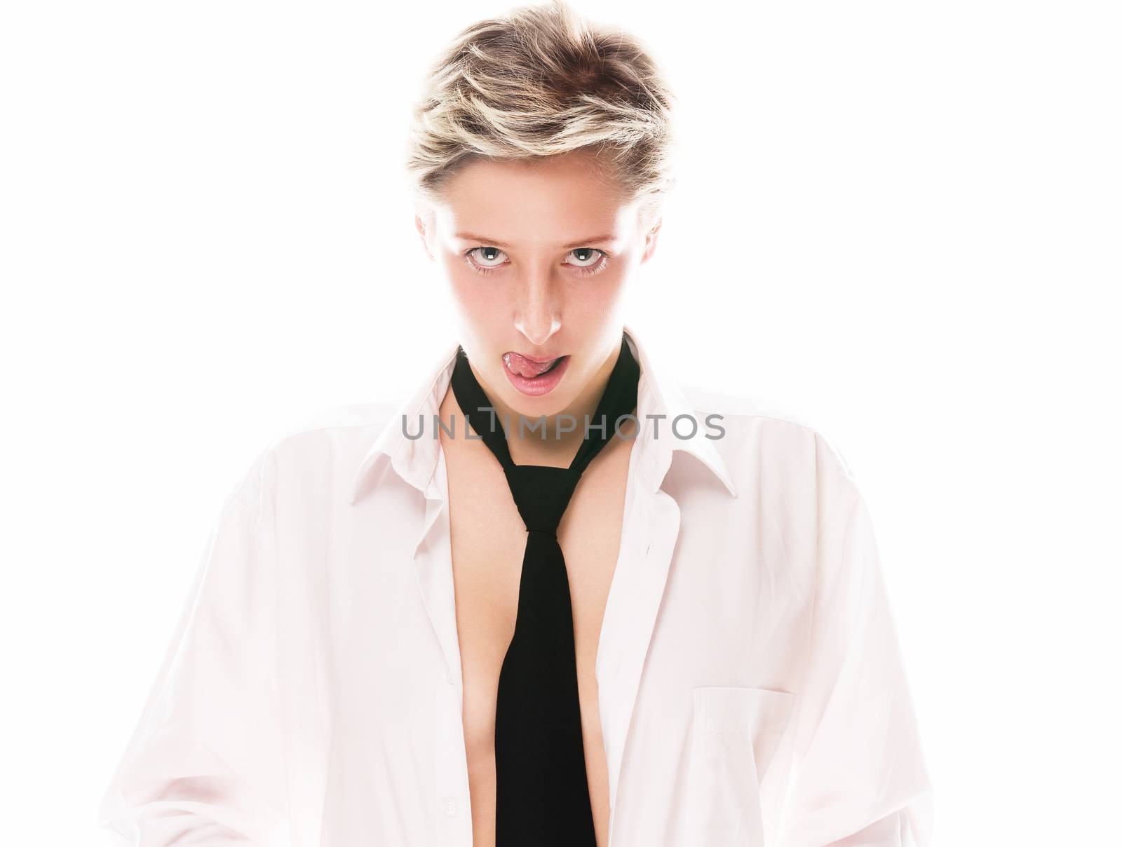 young blonde woman wearing a tie licking her lips on white background