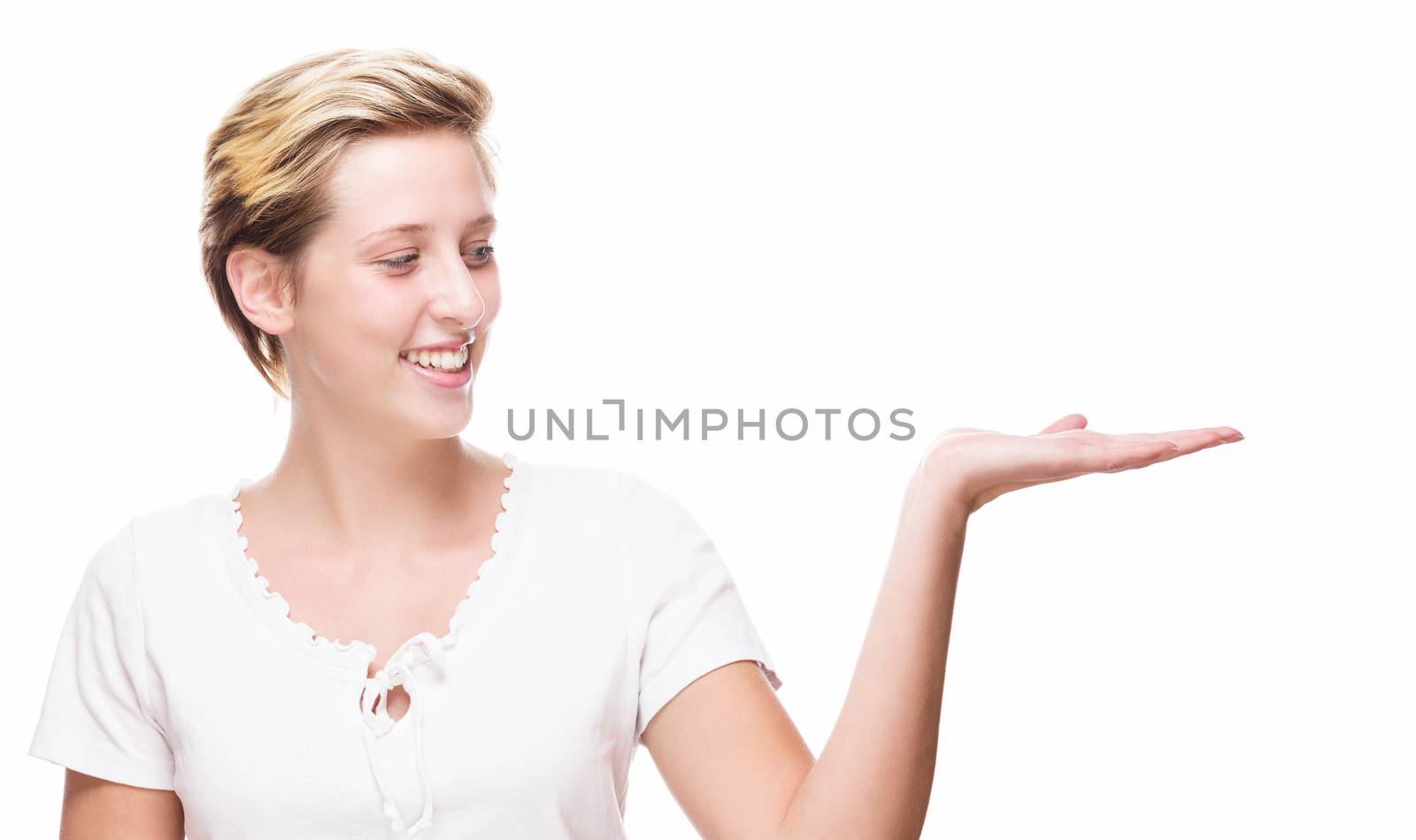 happy woman showing empty hand for product placement on white background