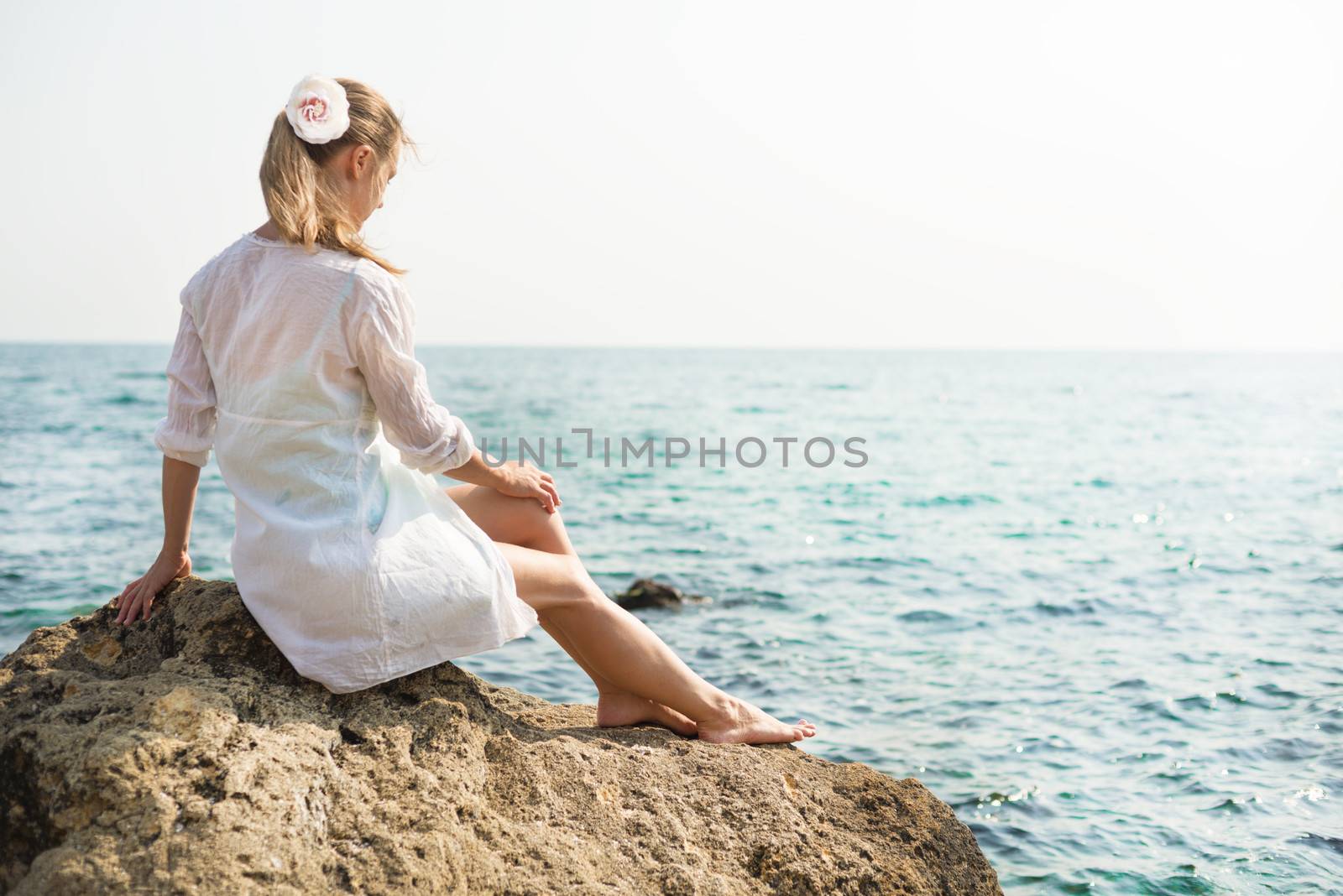 Young beautiful woman near the sea by Nickolya