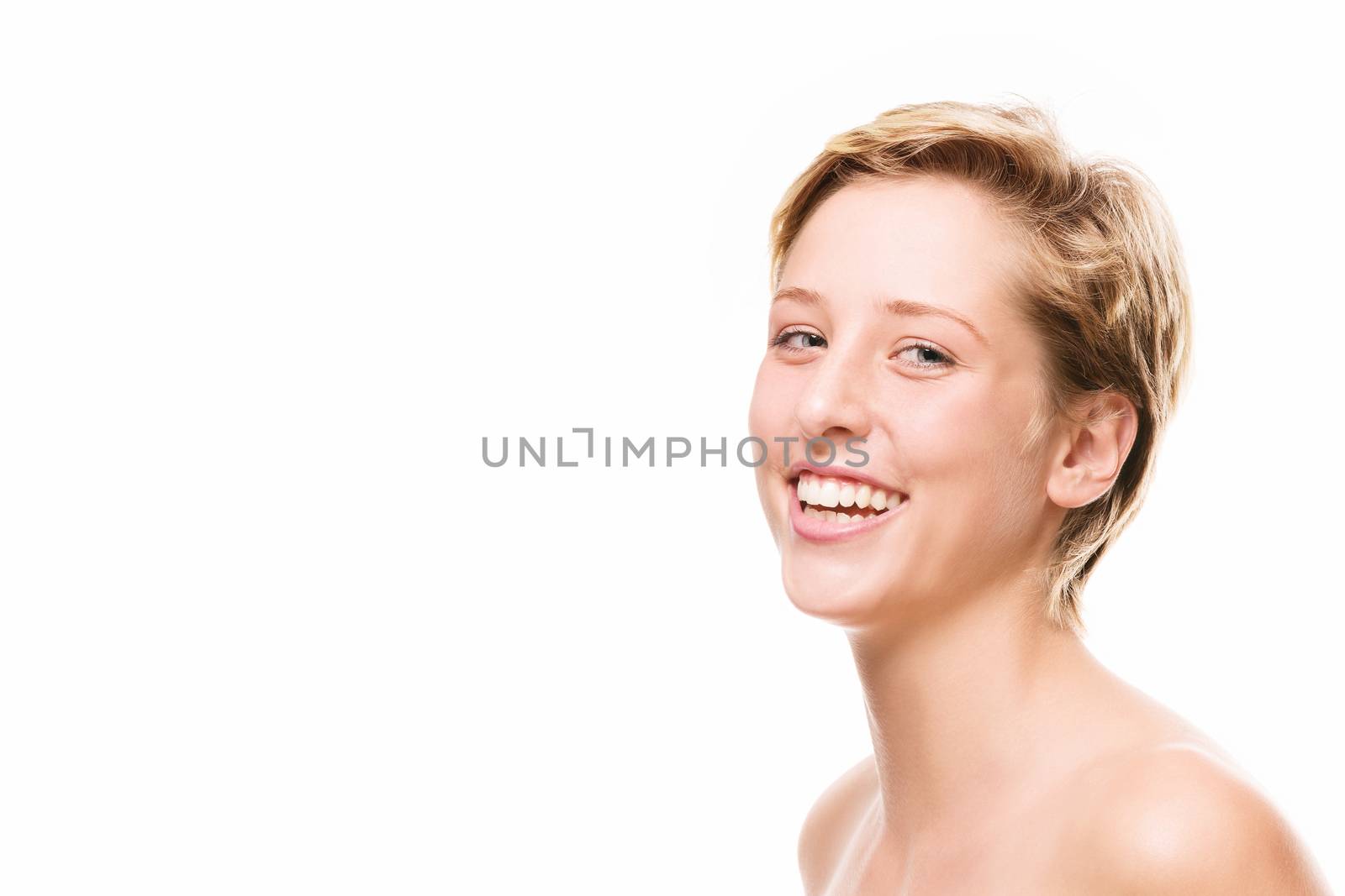 portrait of a laughing young woman on white background