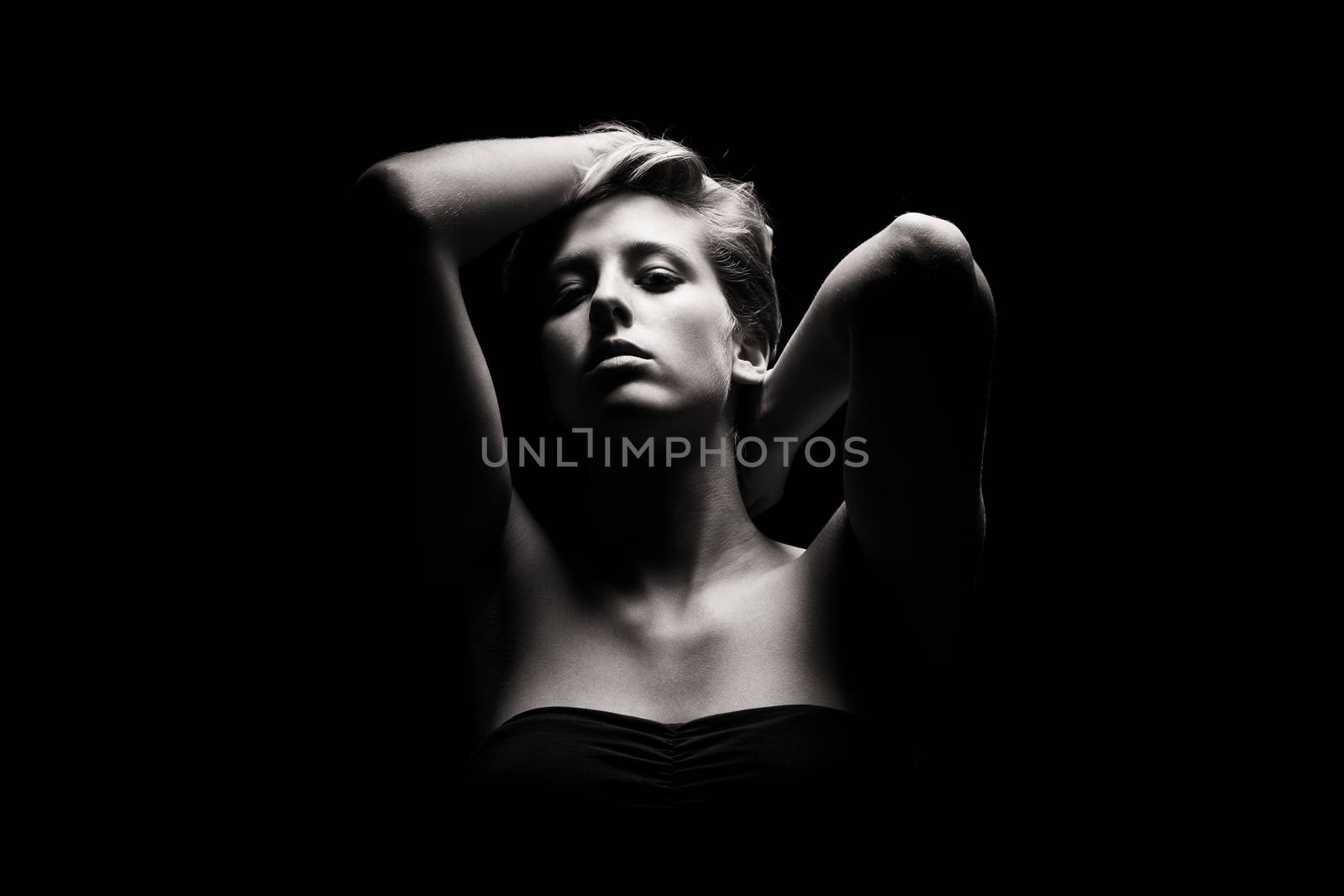 gorgeous woman in tense light in black and white