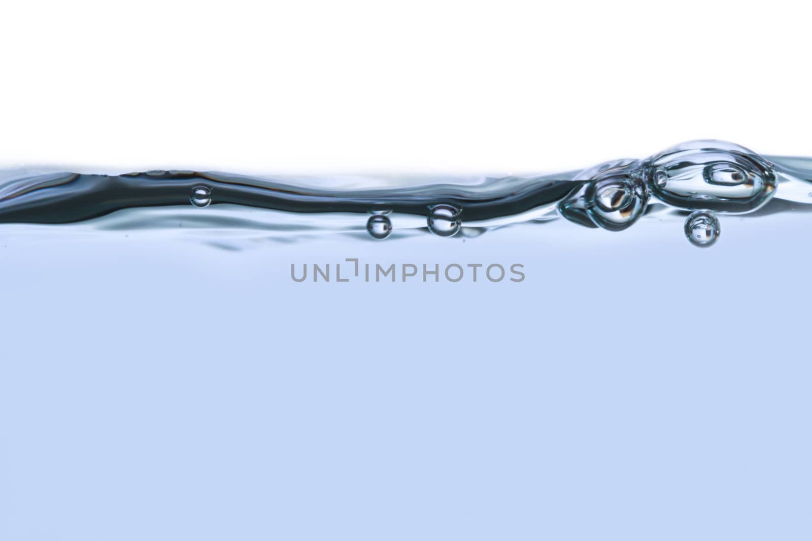 Close up view of water splash with big bubbles, isolated on white background.