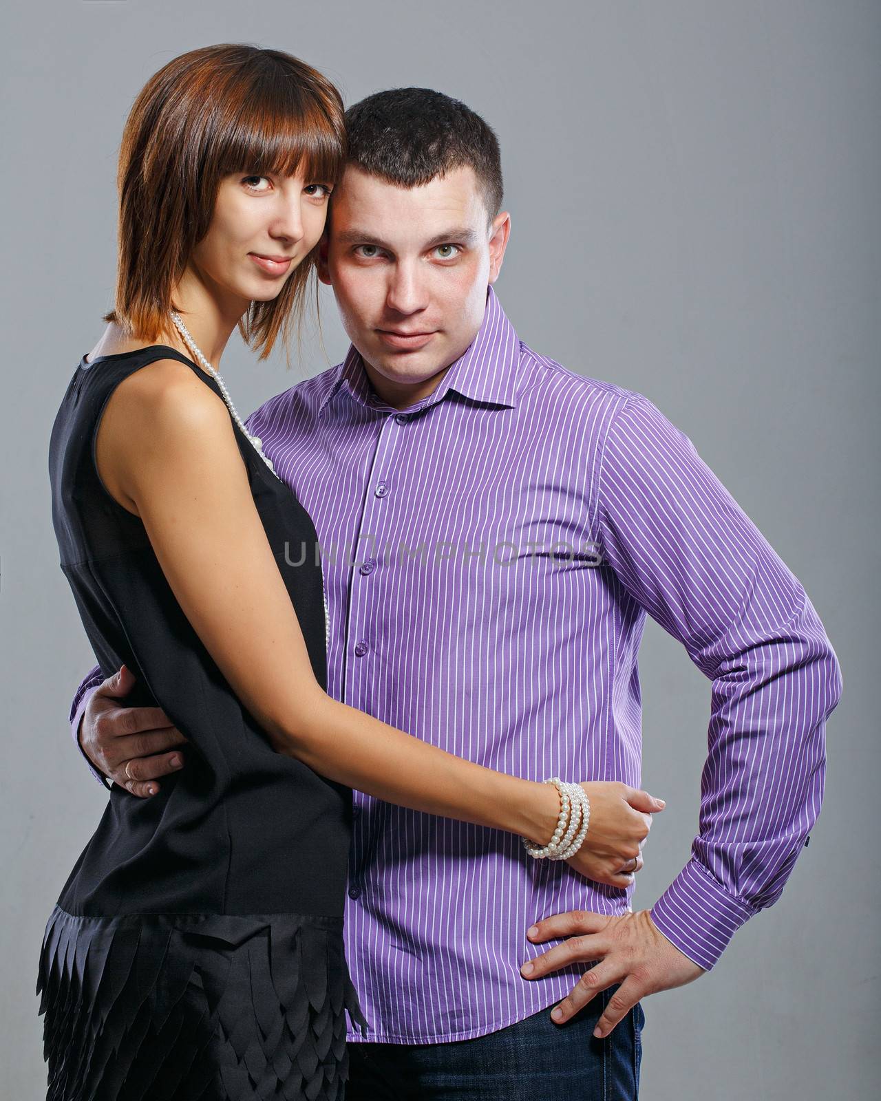 Man and woman embracing in a studio shot