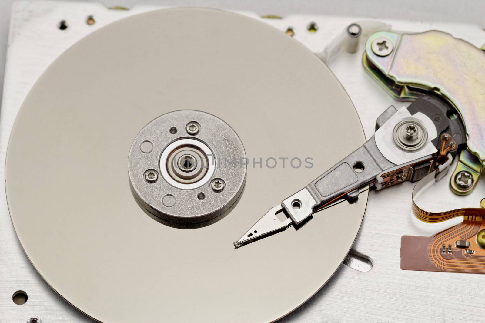 Open computer hard drive on white background with spezial color filter (HDD, Winchester)