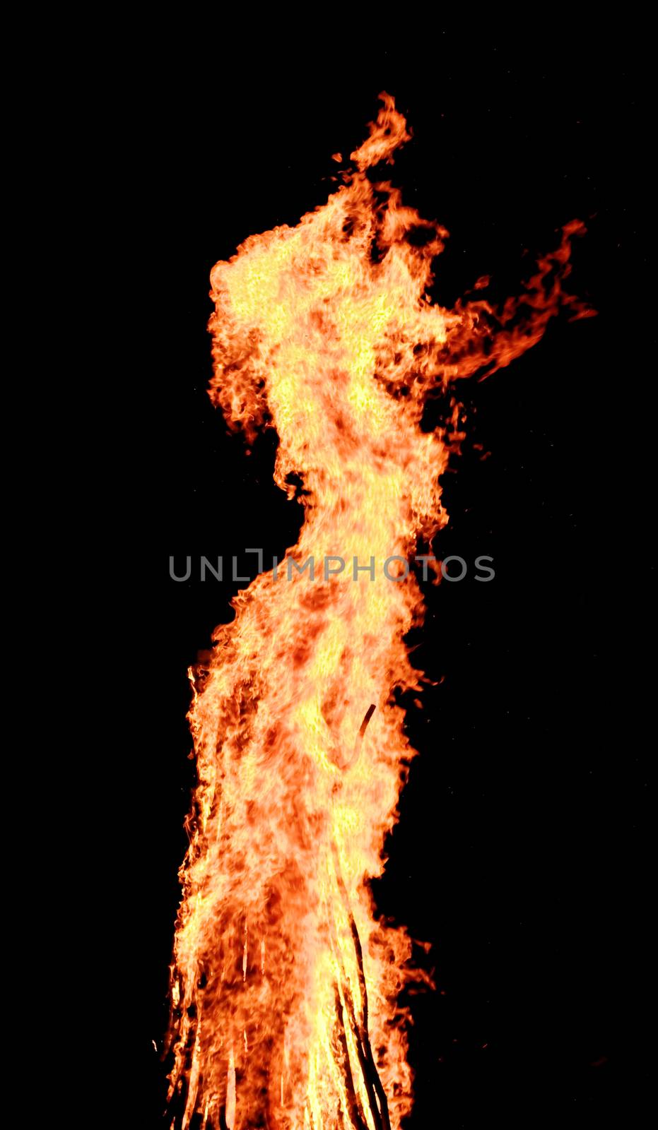 red flames of huge bonfire or campfire as black backgorund