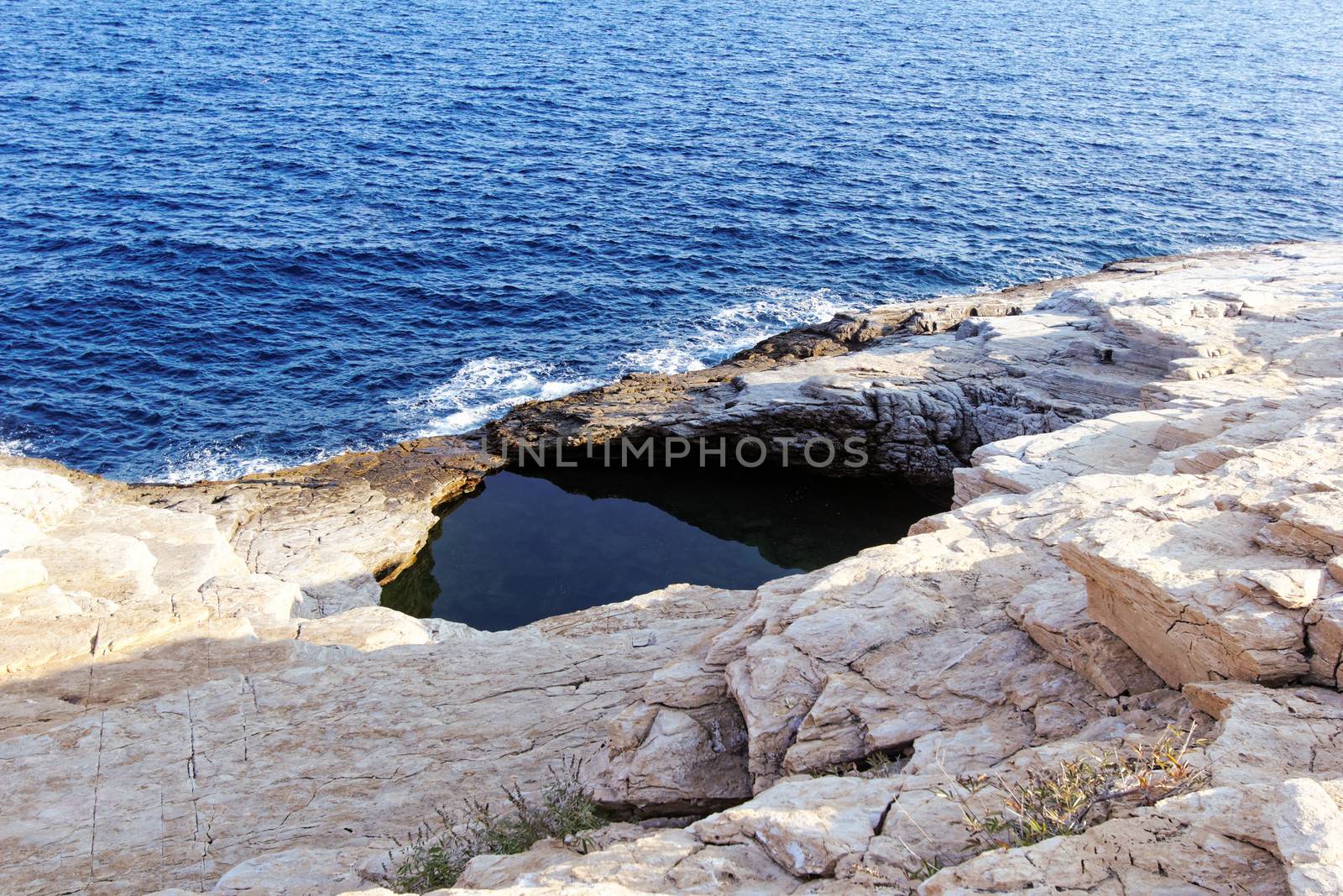rocky beach and natural pool in greece thassos (giola)