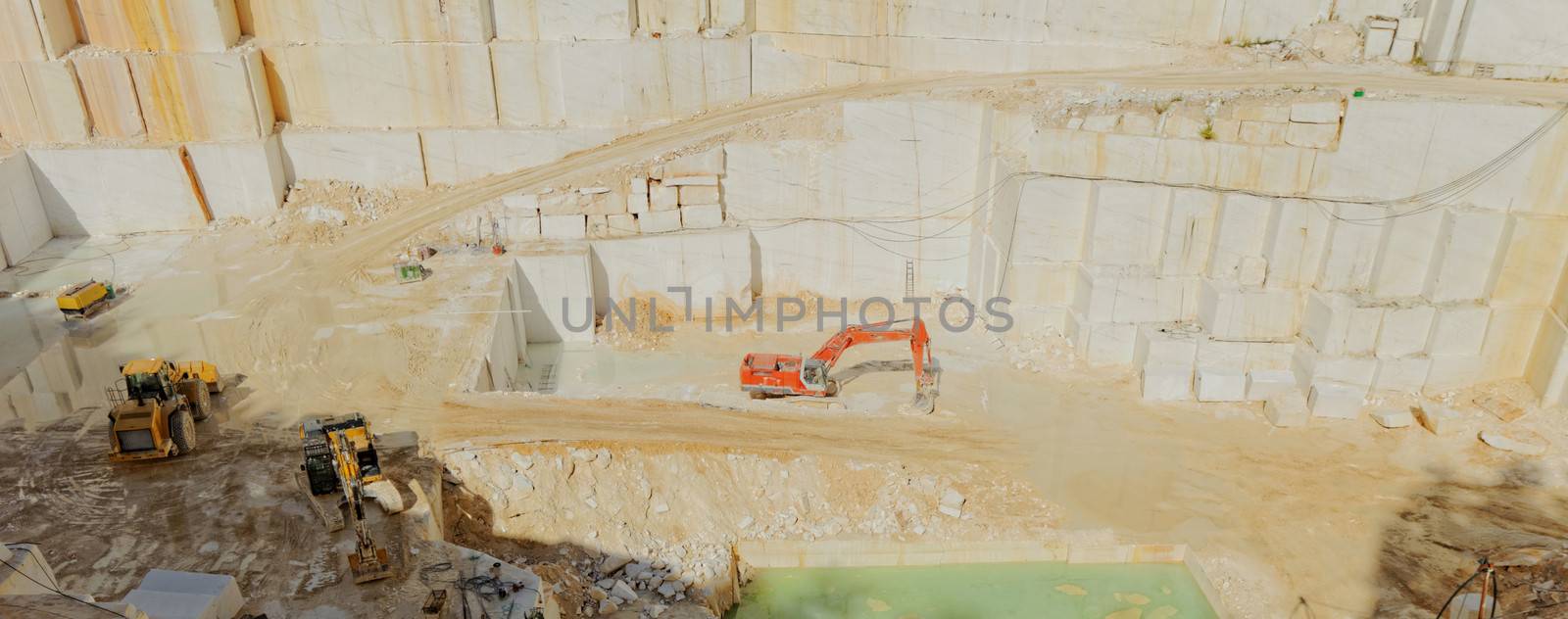 Detail of huge Thassos white marble quarry (mine) with grabber