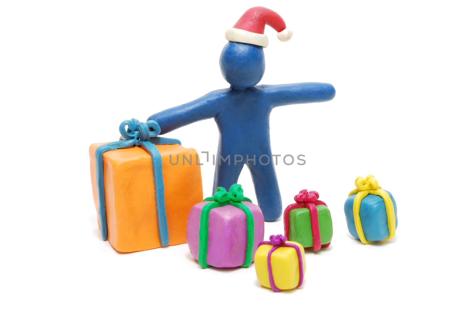 Plasticine Santa Claus with Heap of Various Gift Boxes Isolated on White