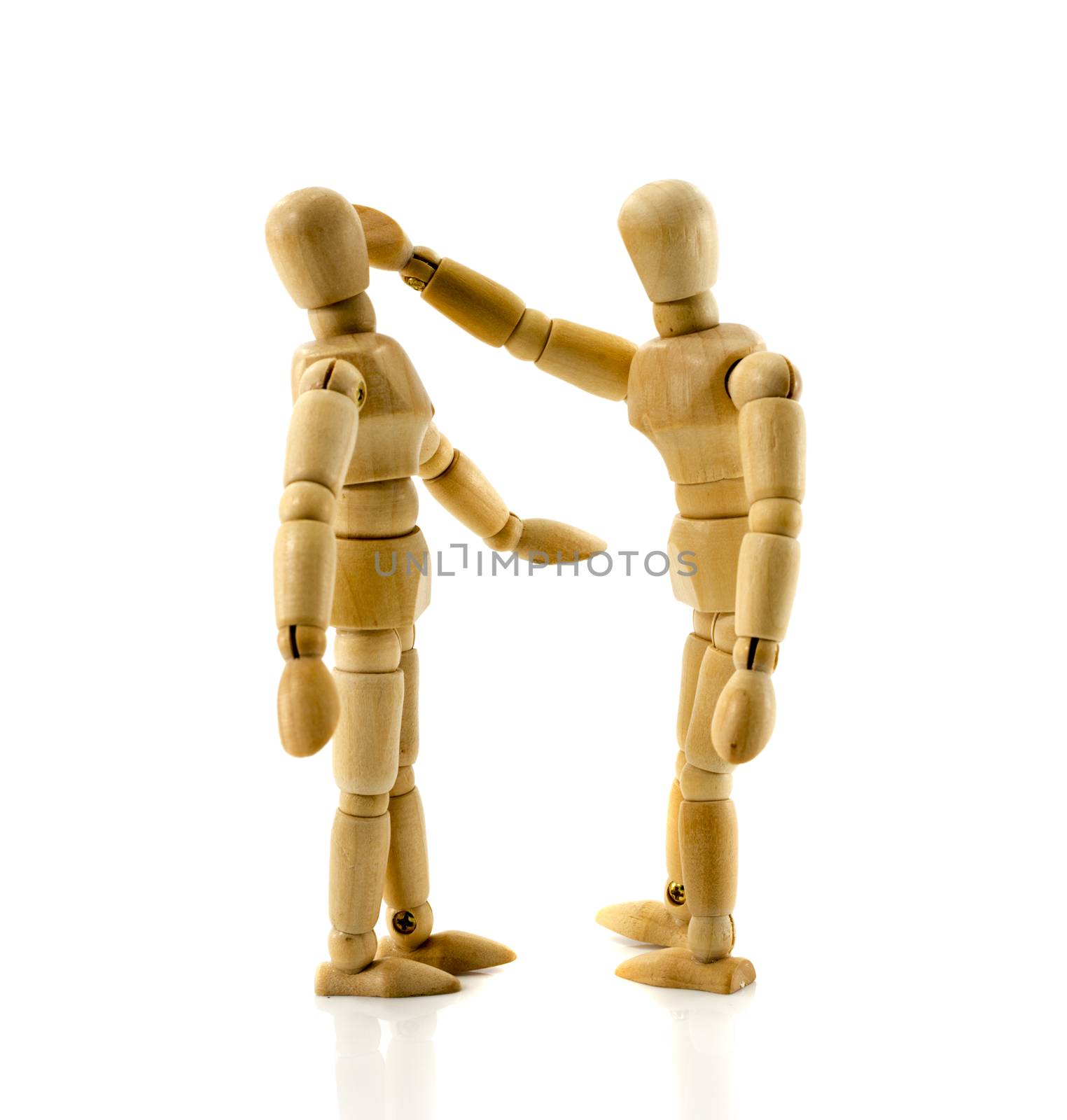 senseless violence wooden puppets on white background