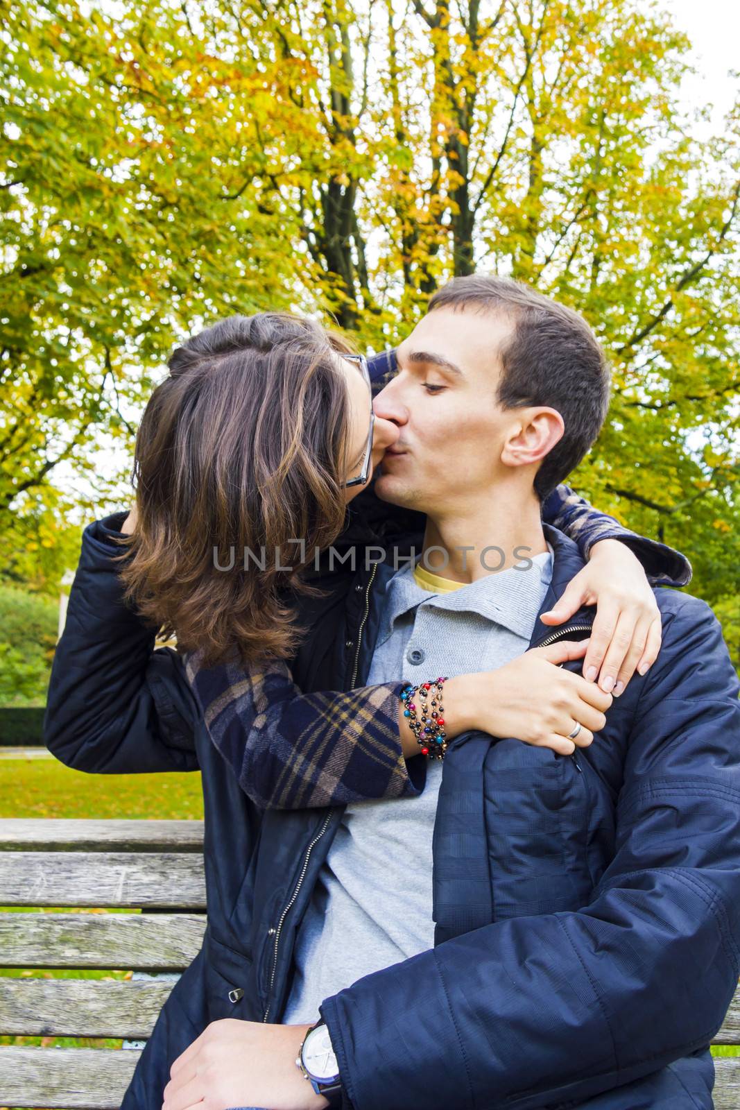 Love couple closeup kissing looking happy by Tetyana