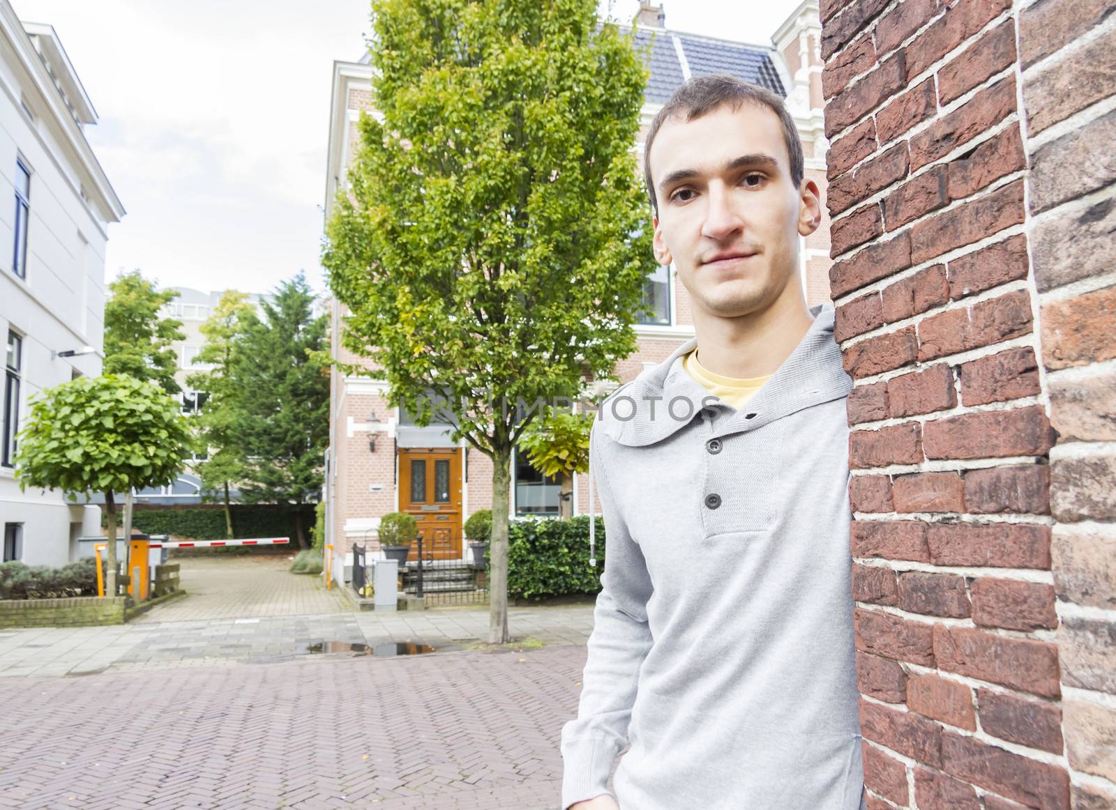 Portrait of handsome man outdoors by Tetyana