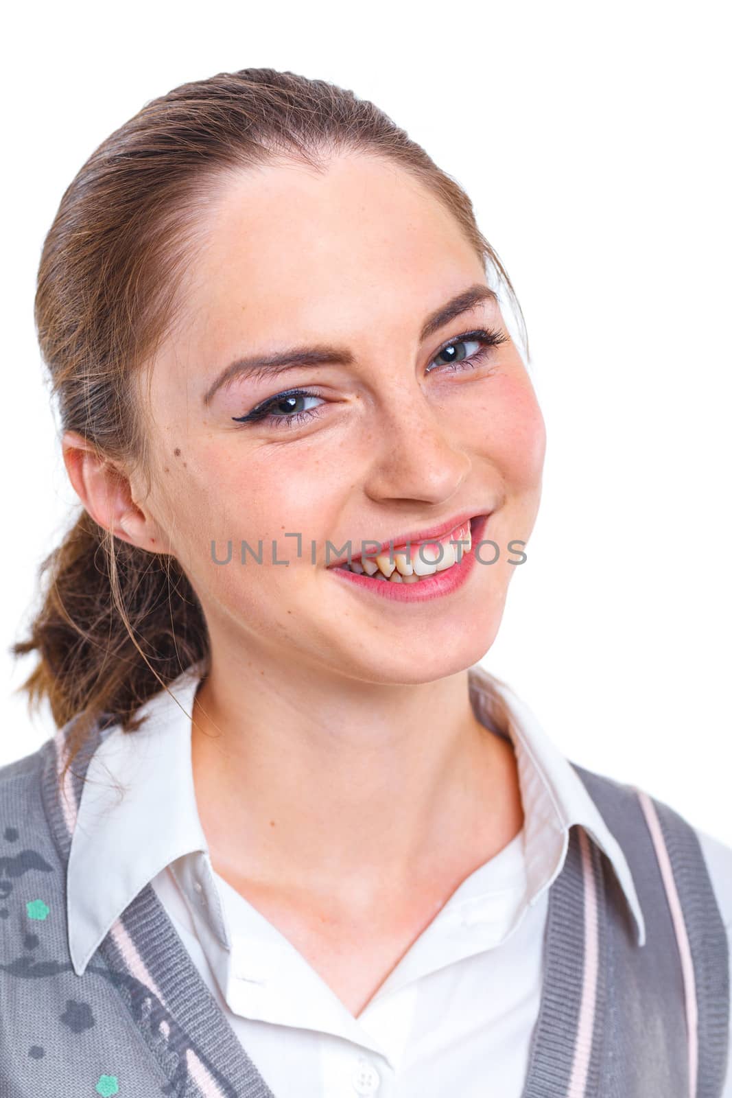 Smiling teenager girl in studio. Isolated white background
