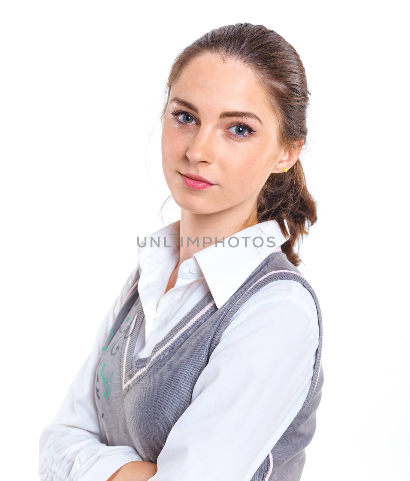 Smiling teenager girl in studio. Isolated white background