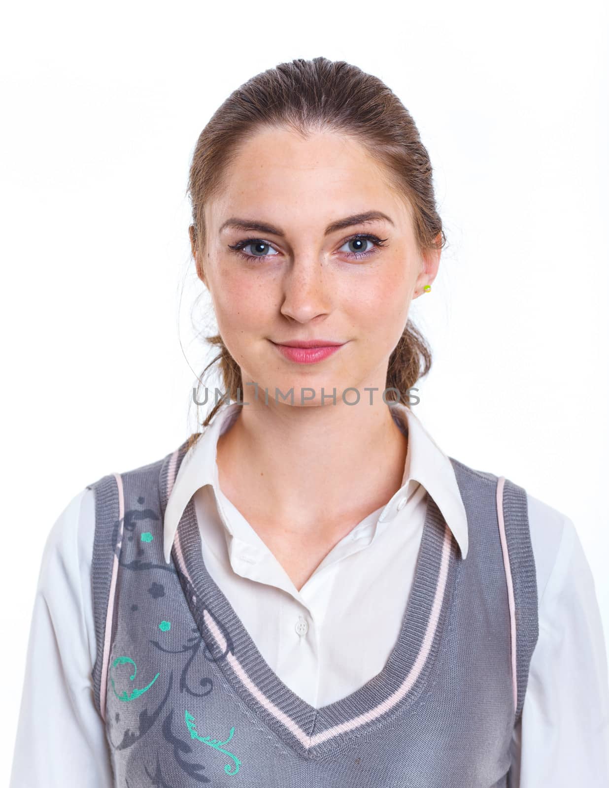 Smiling teenager girl in studio. Isolated white background