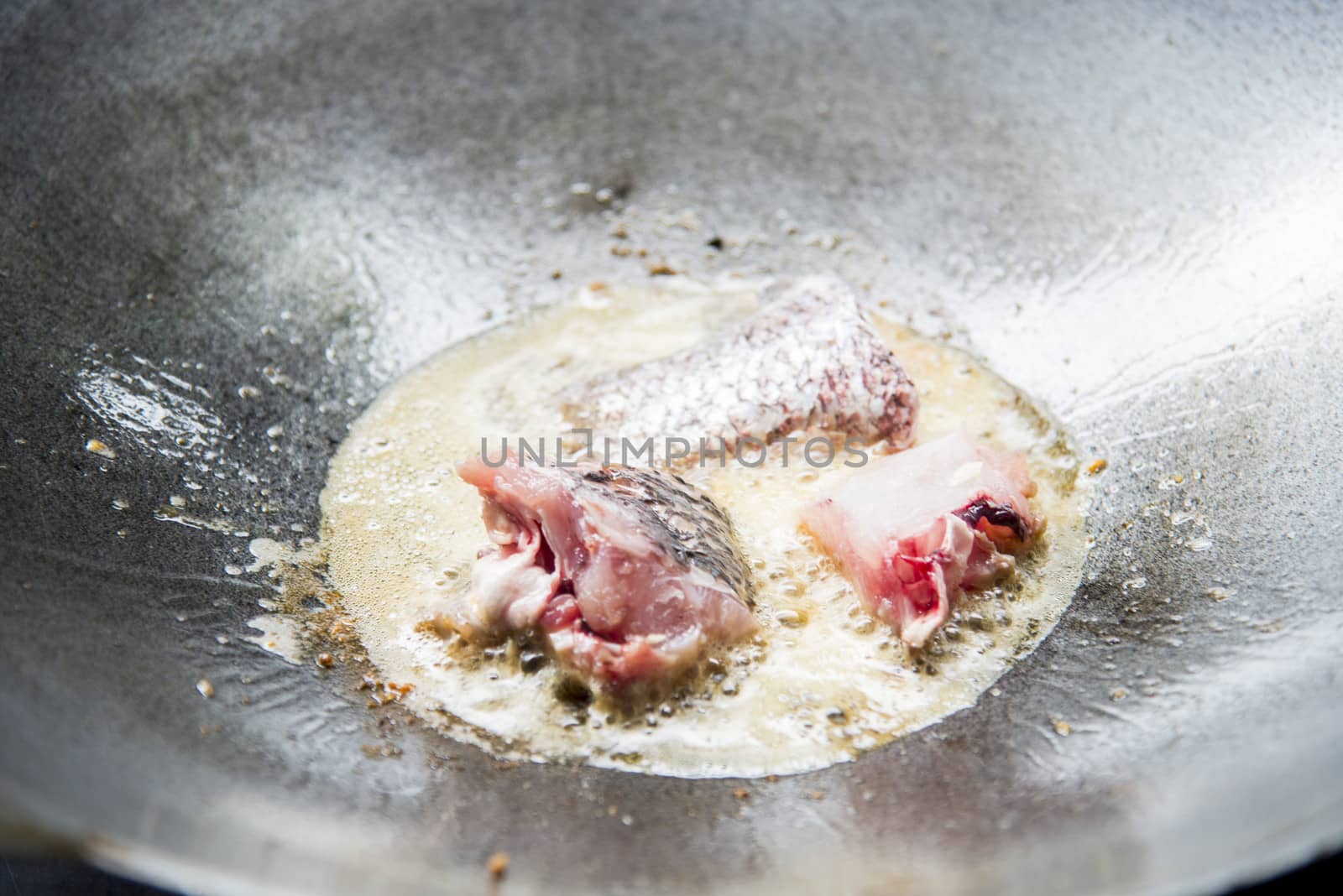 Fried pieces of fish in a pan5 by gjeerawut