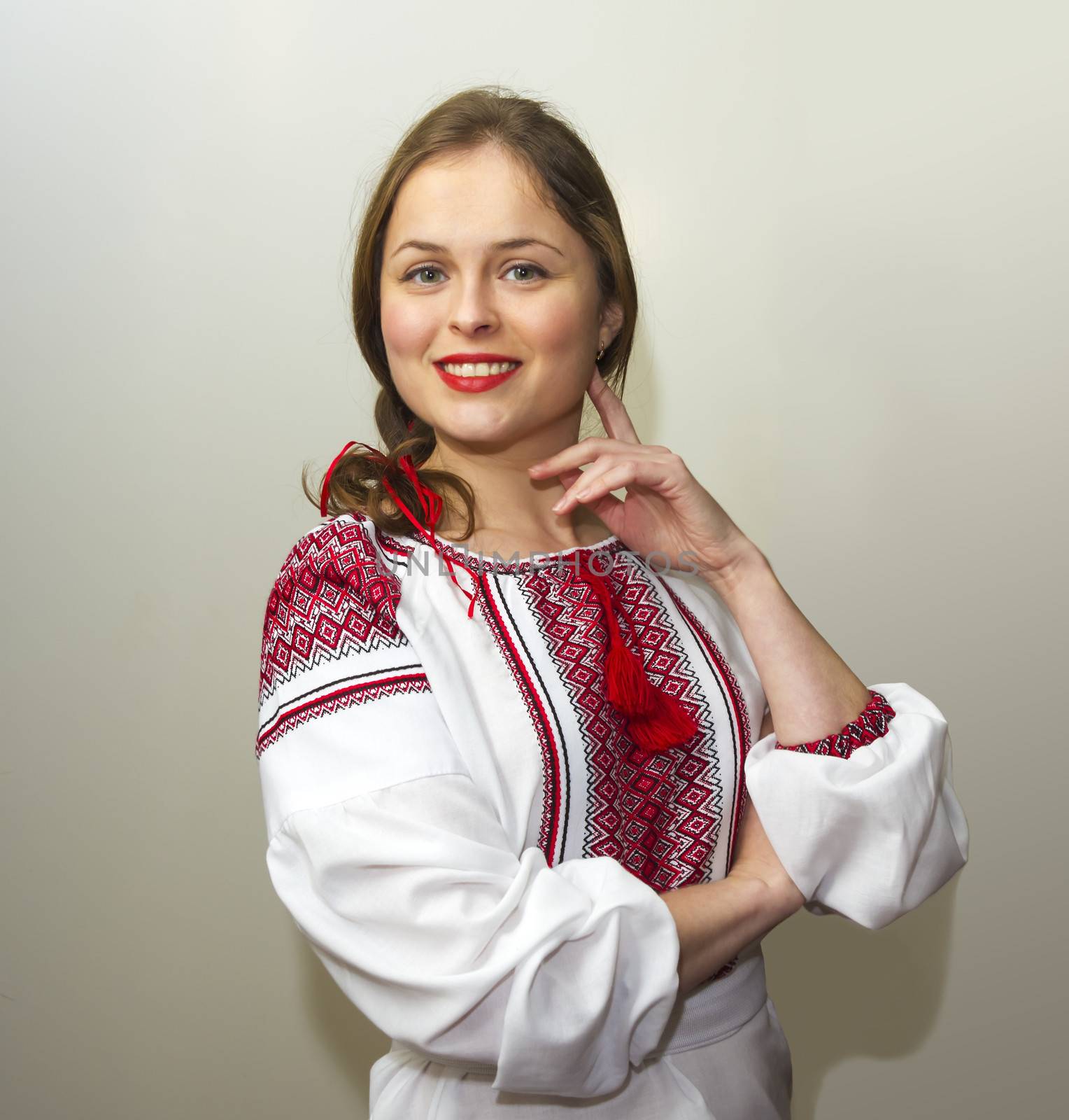 Portrait of beautiful young woman in the Ukrainian national clot by Tetyana