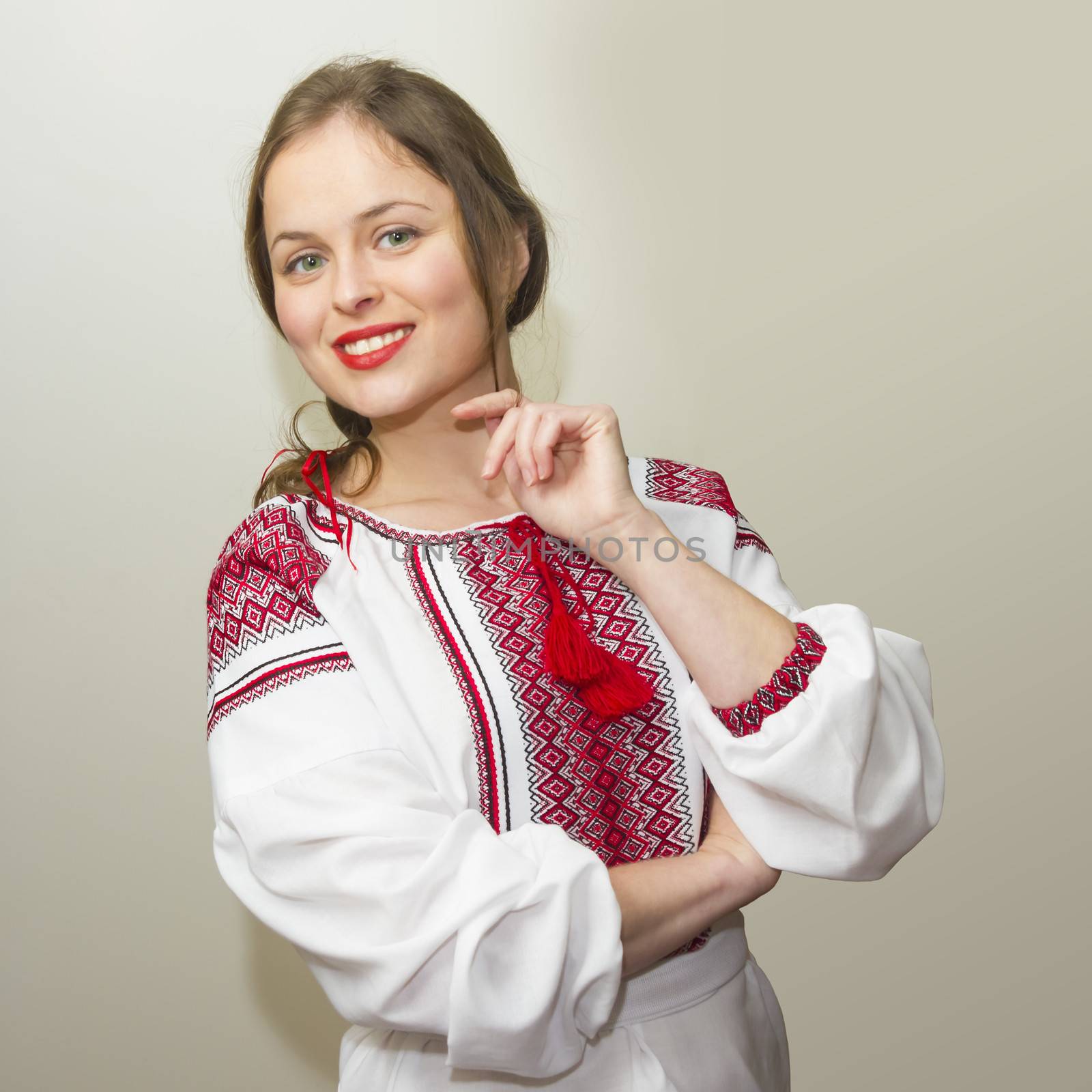Portrait of beautiful young woman in the Ukrainian national clothes
