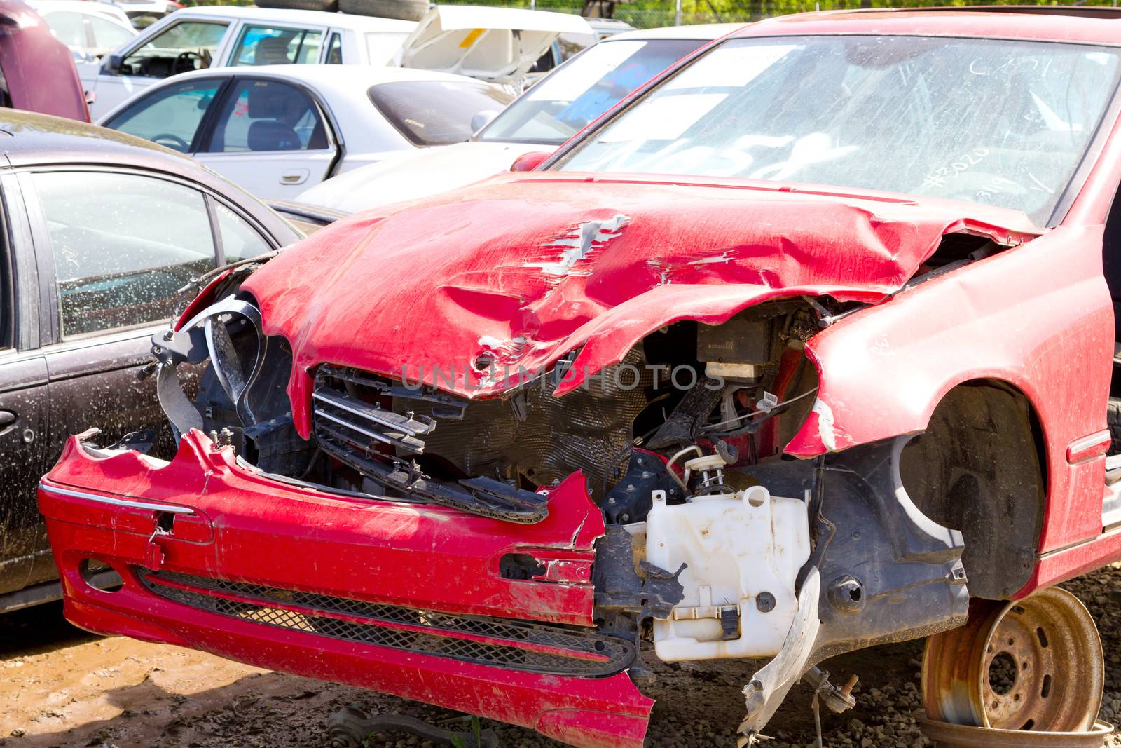 Detail of a vehicle at the auto salvage yard after a major accident collision.