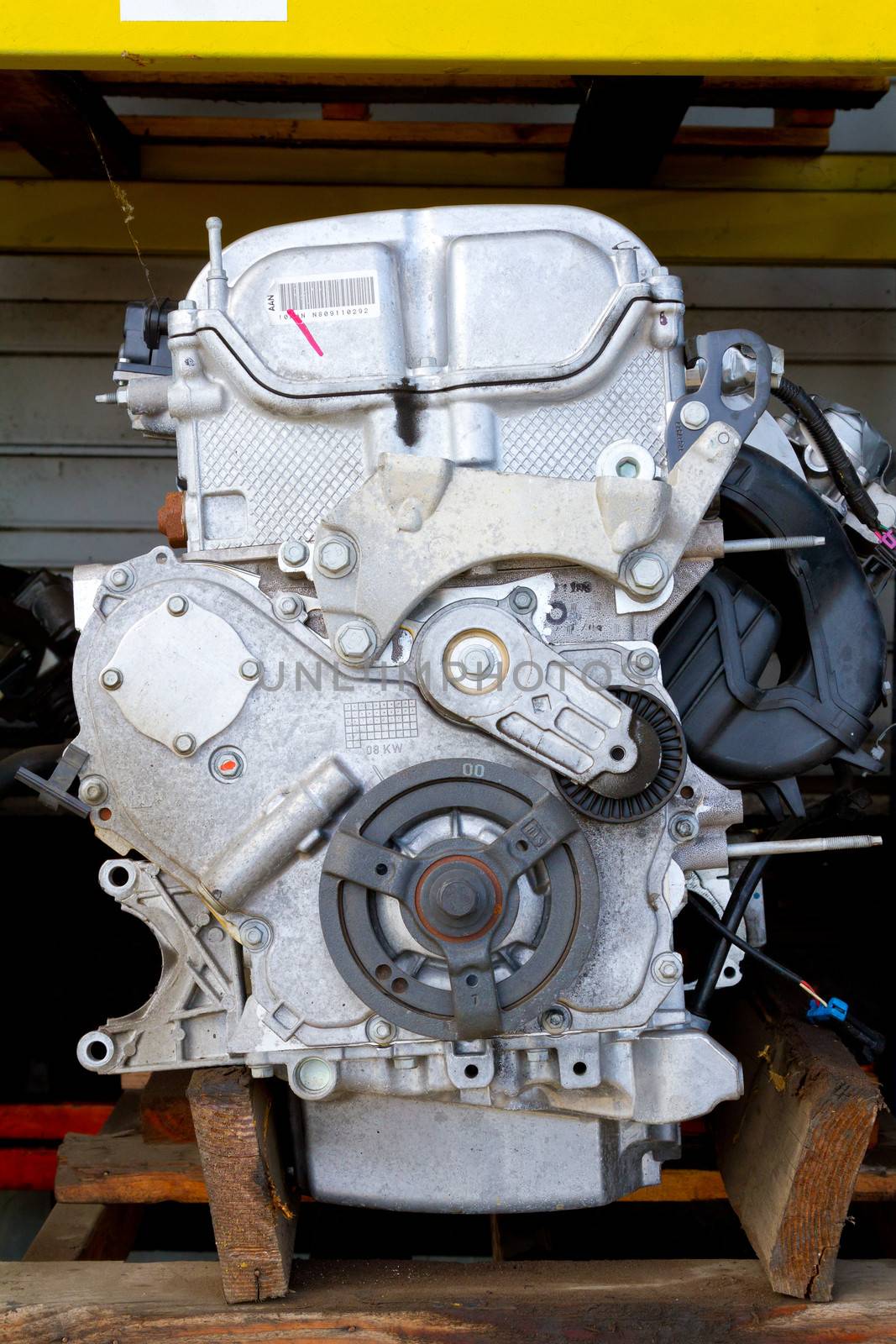 Engine blocks or motors and their gears and working parts are photographed to show the pieces at this junkyard.