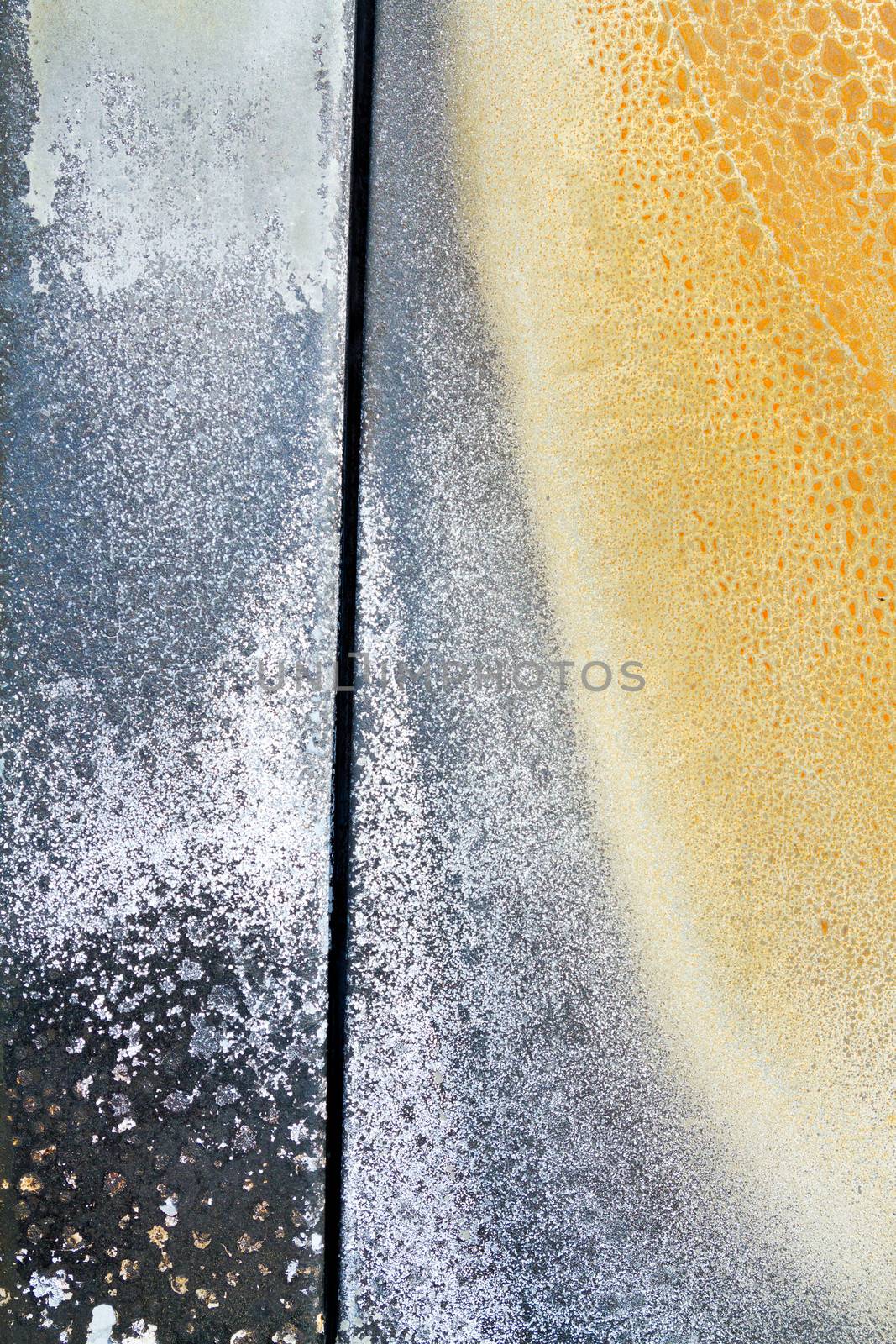 Abstract background color image of pieces at a junkyard auto salvage yard.