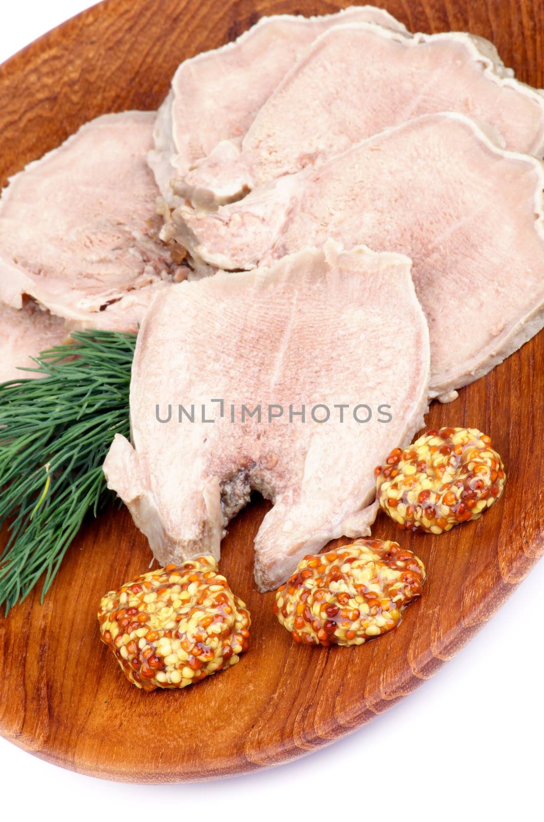 Slices of Delicious Boiled Beef Tongue with Whole Grain Mustard and Dill on Wooden Plate closeup