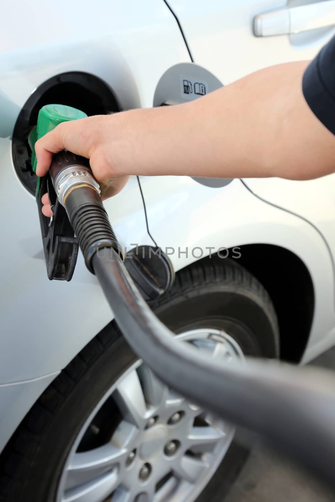 Petrol or gasoline being pumped into a motor vehicle car