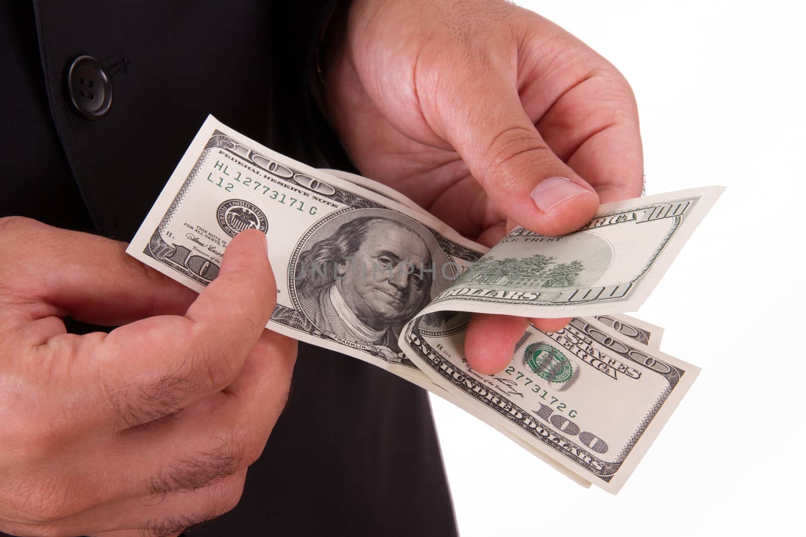 Businessman holding and counting money, hundred dollars, isolated on white background.