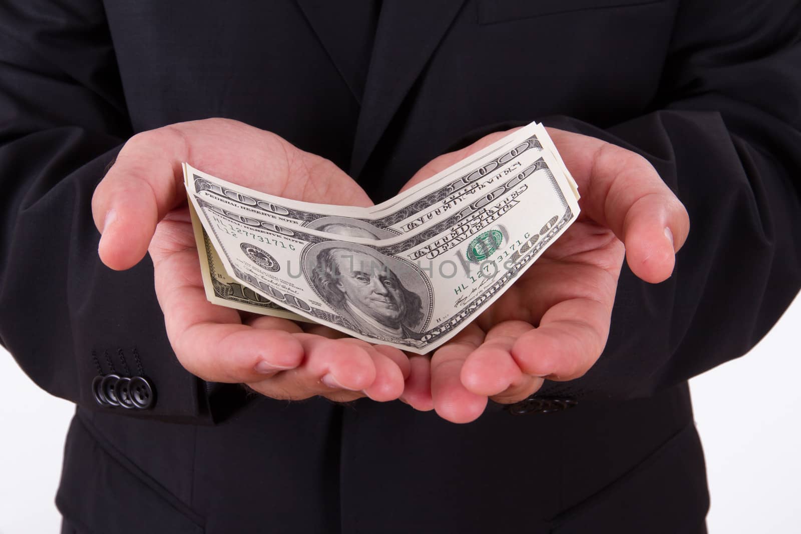 Businessman dark jacket, holding money, hundred of dollars.