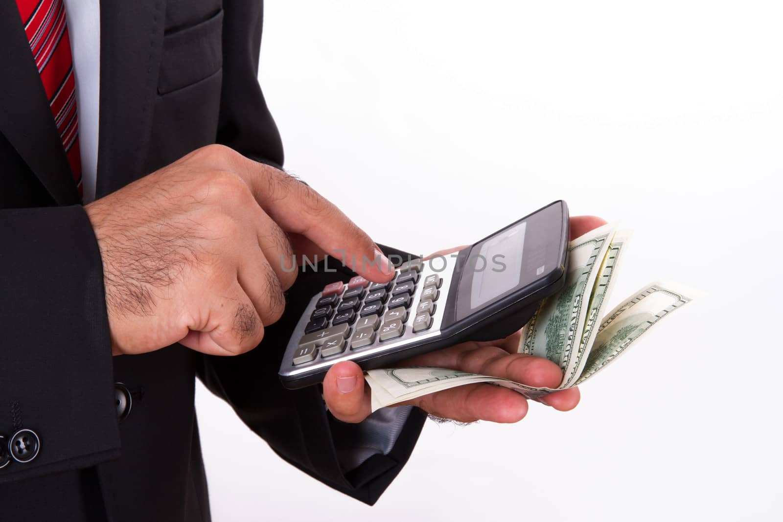 Businessman calculating something with calculator and some money, isolated on white background.