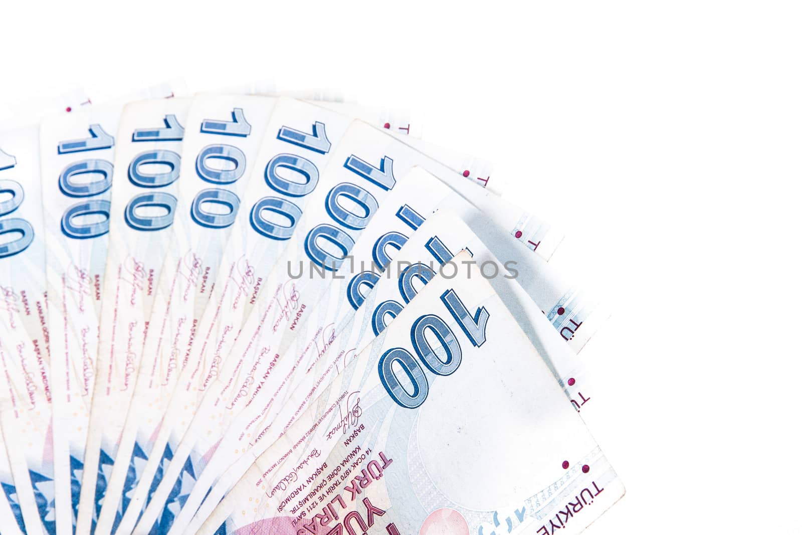 Money in a row, isolated on white background.