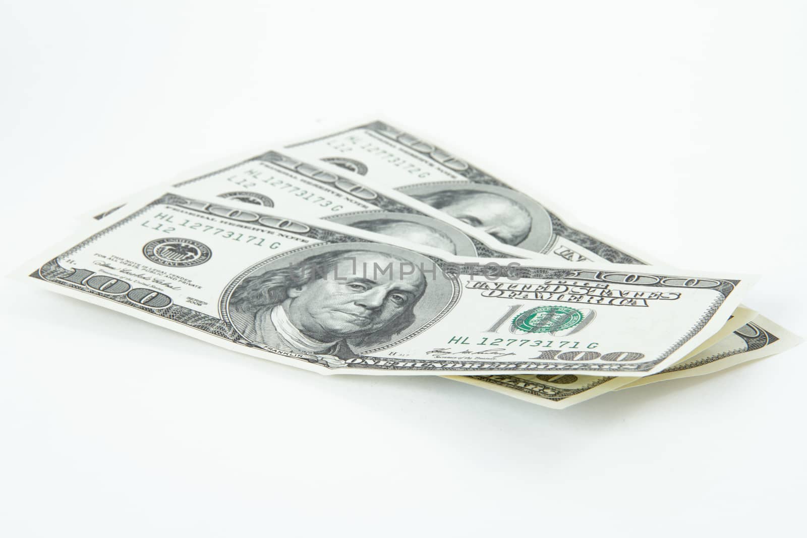 One hundred dollar bills, isolated on white background.