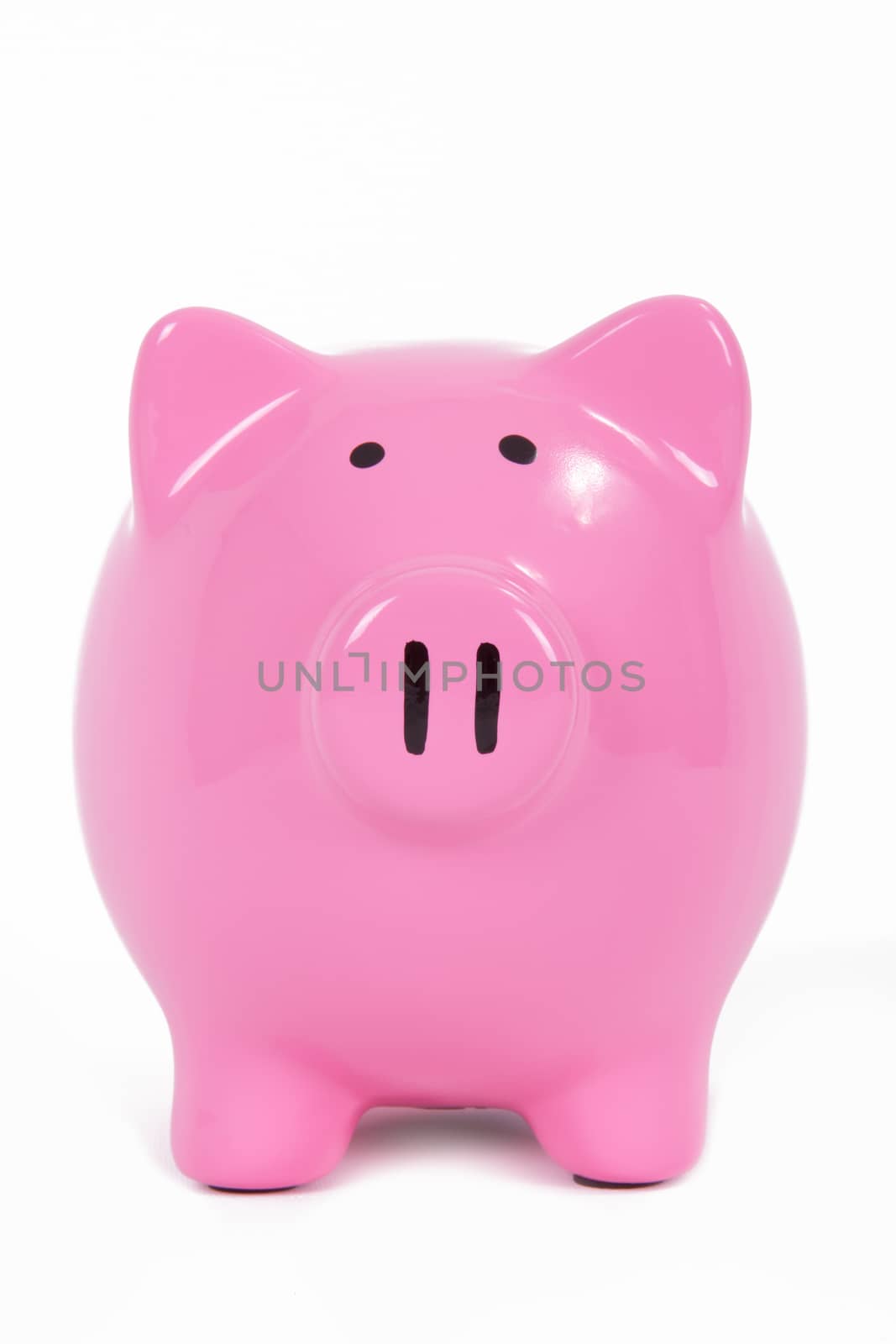 Pink piggy bank front view, isolated on white background.