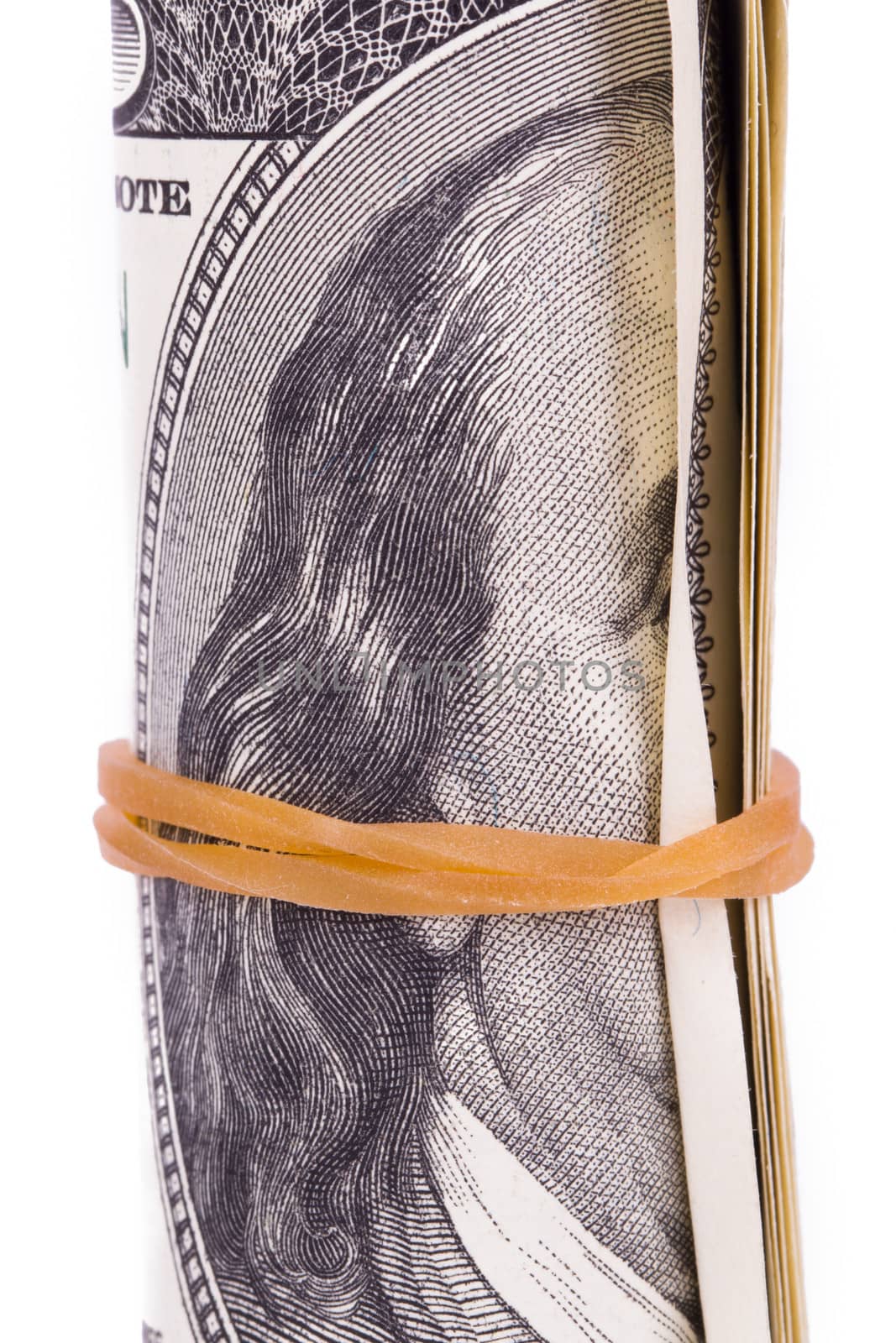Roll of one hundred dollar banknotes, isolated on white background.