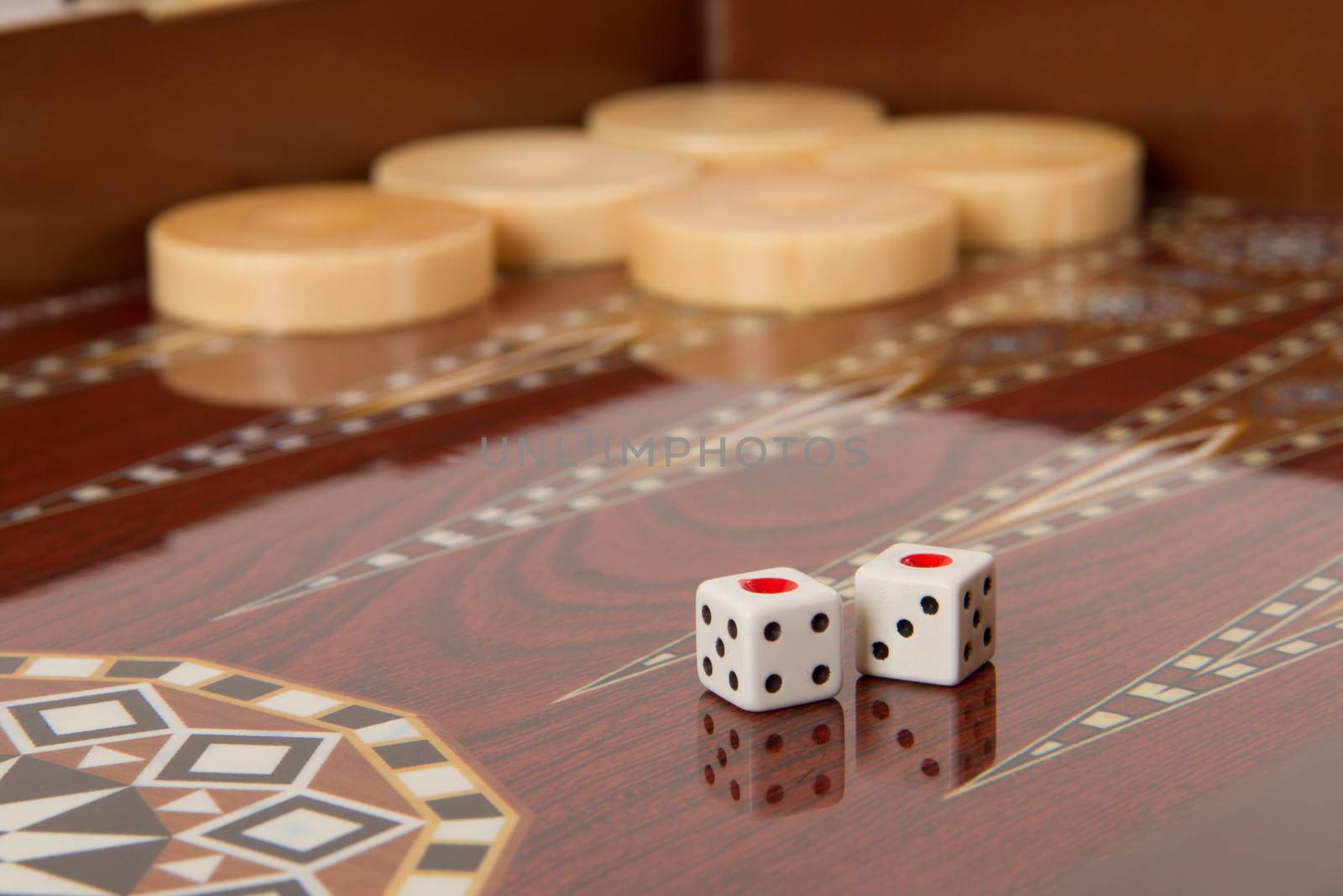 Backgammon table, chips and dice with double one.