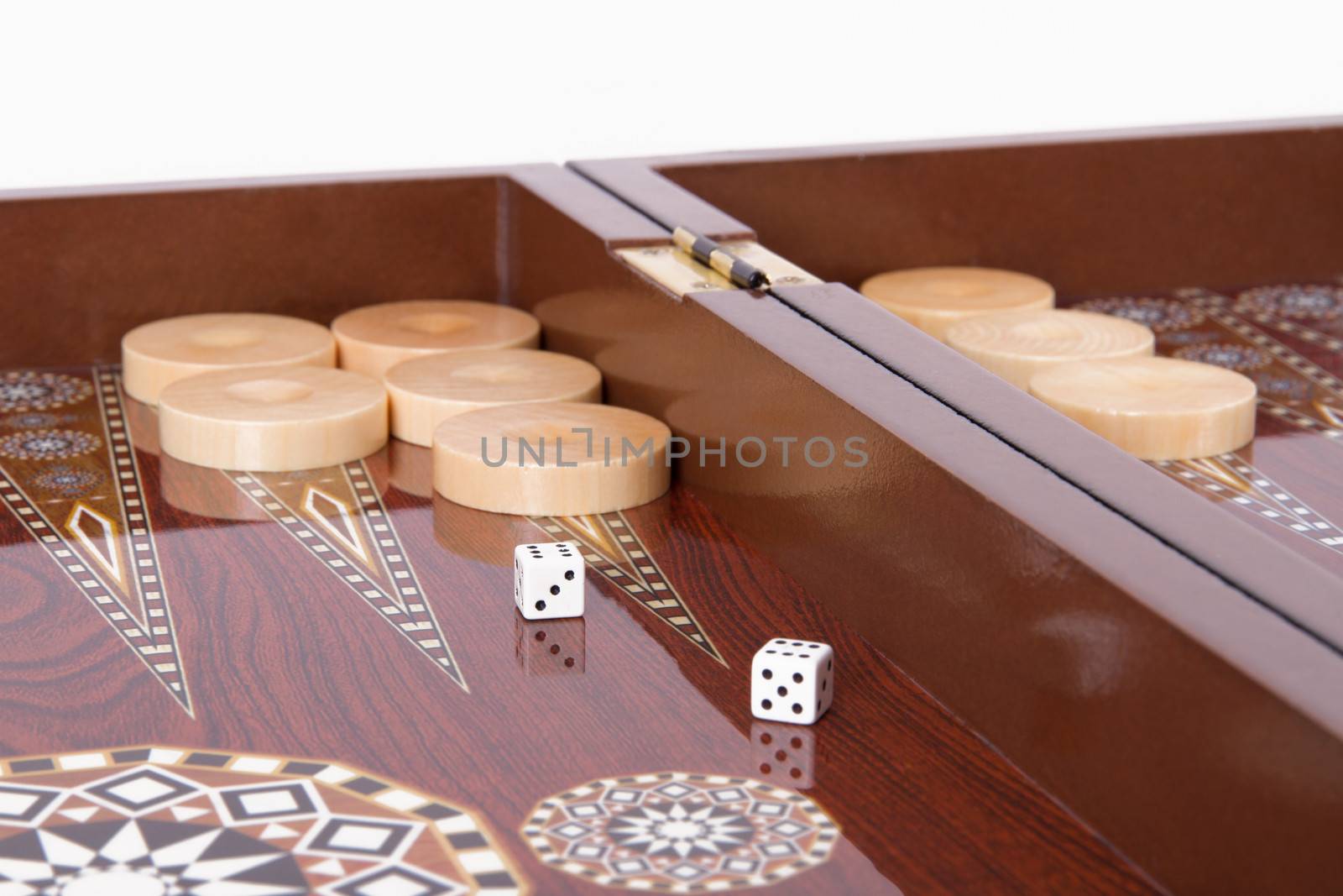 Backgammon table, chips and dice with double six.