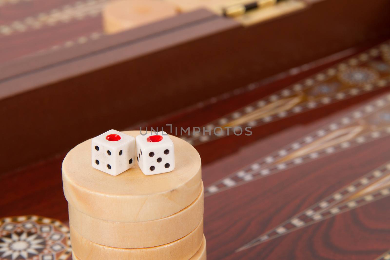 Backgammon table, chips and dices with double one.