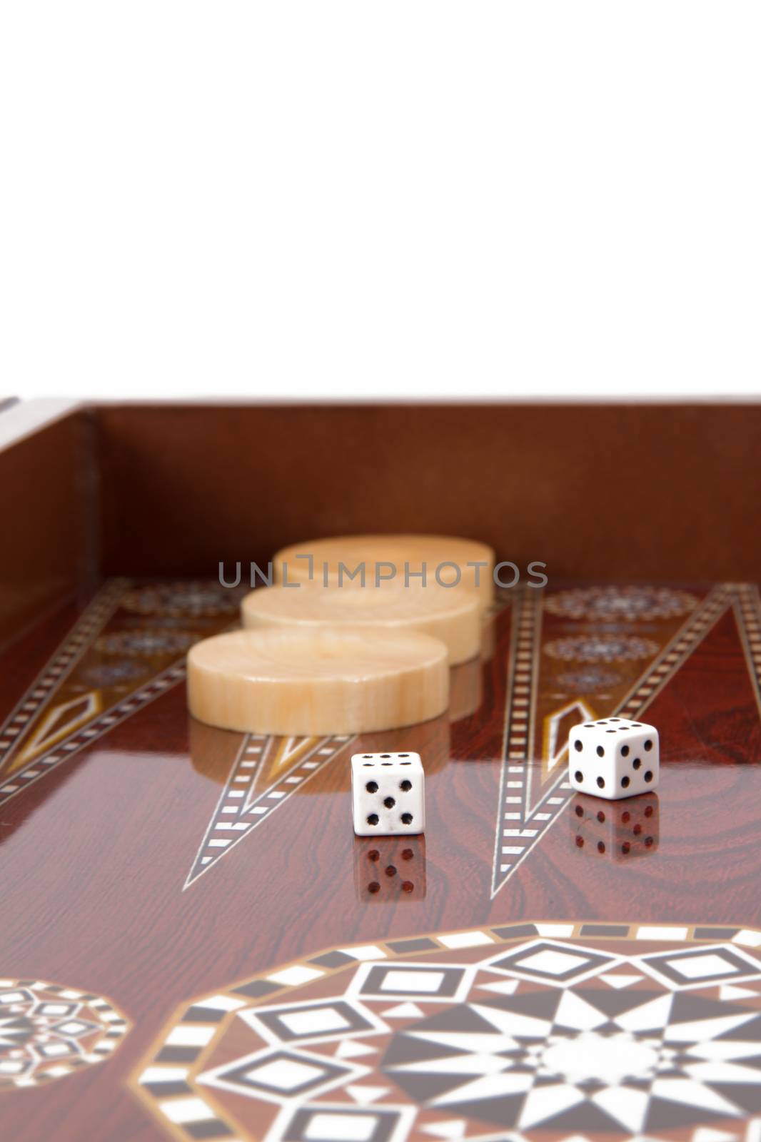 Backgammon table, chips and dice with double six.