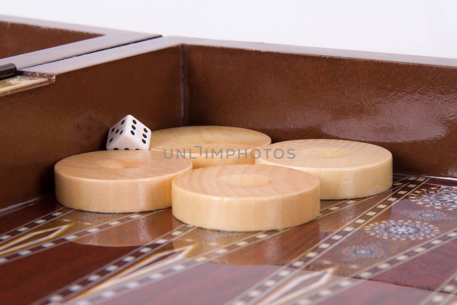 Backgammon chips and dice on table.