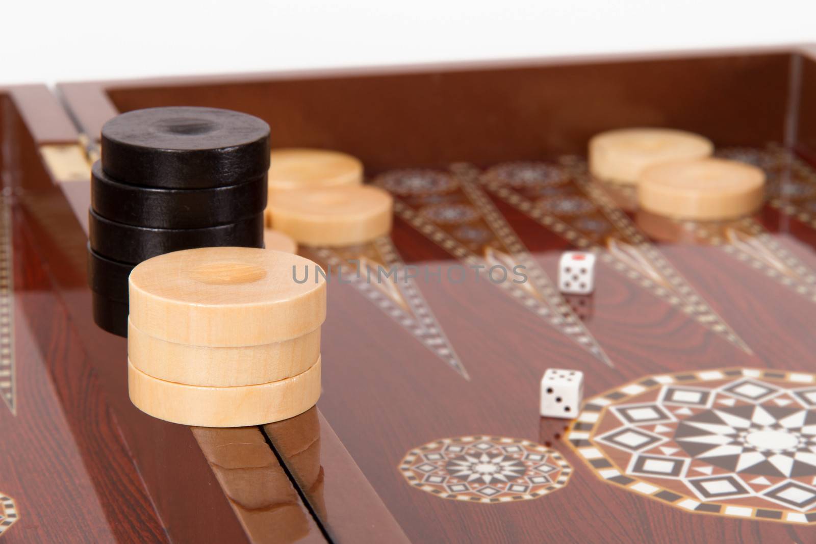 Backgammon chips and dice on table.