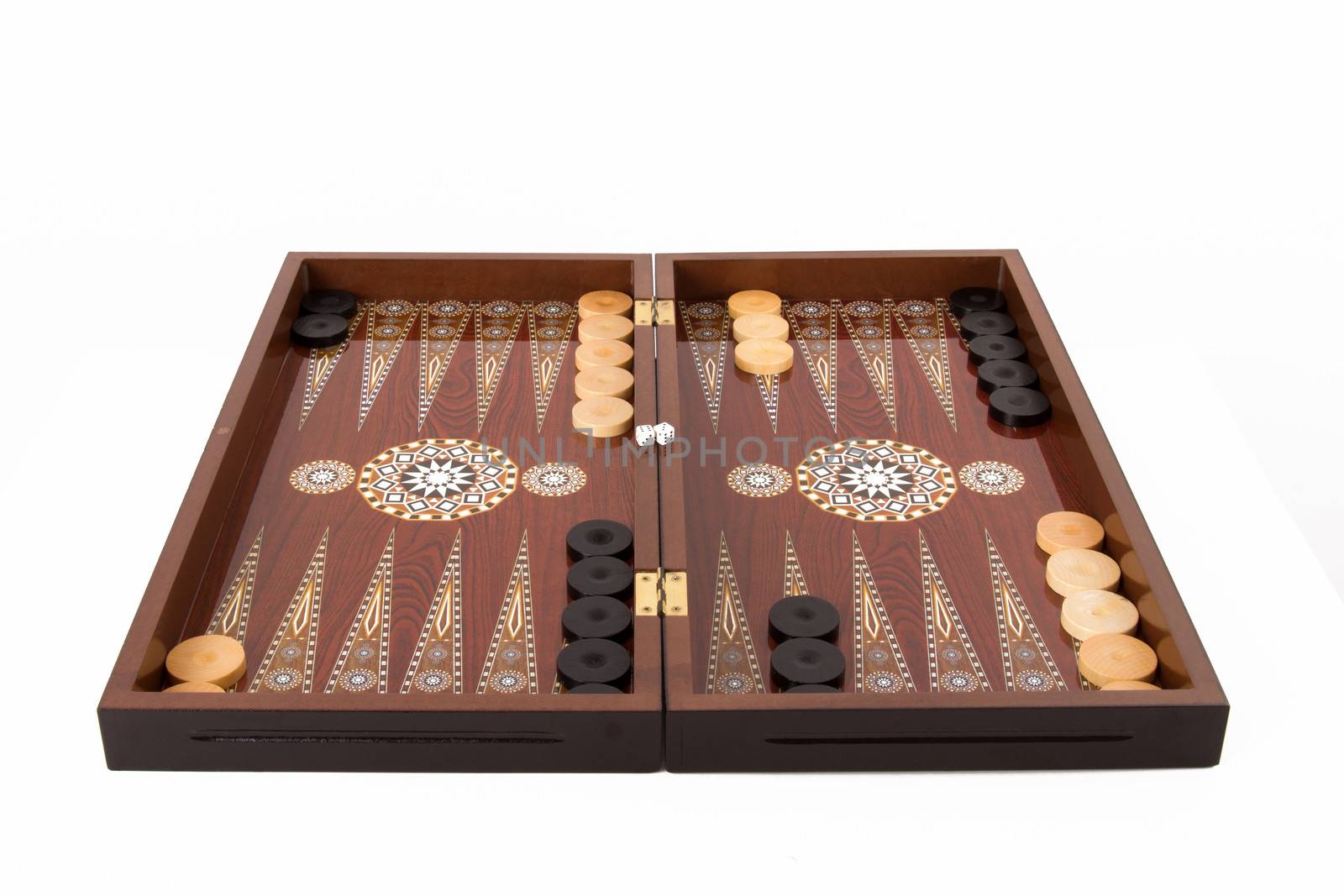 Backgammon set with table, chips and dice at the beginning, isolated on white background.