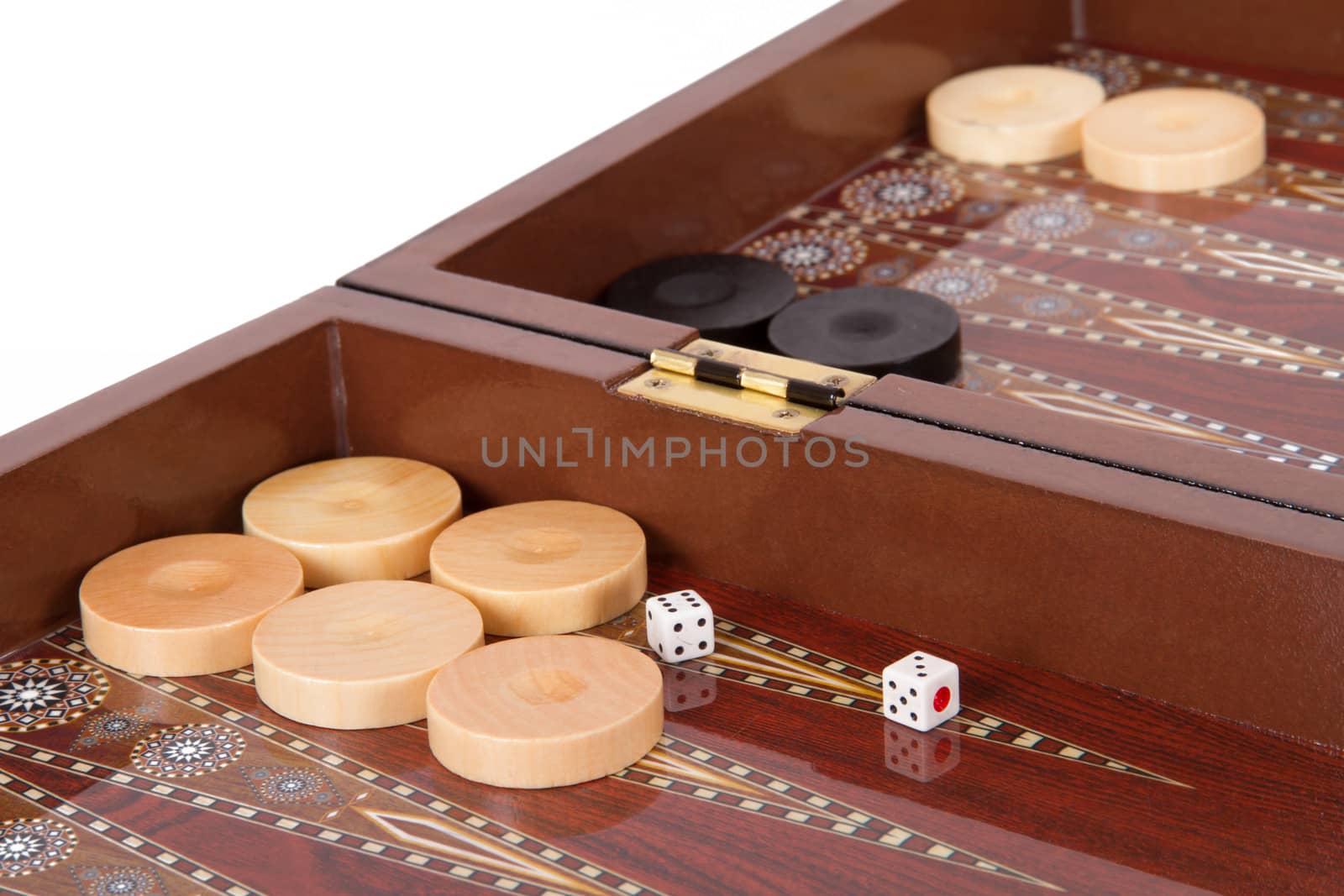 Backgammon table, chips and dice with three and six.
