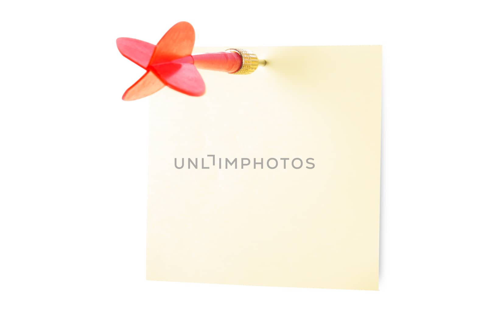 Red, plastic dart arrow and yellow sticky post it note, isolated on white background.