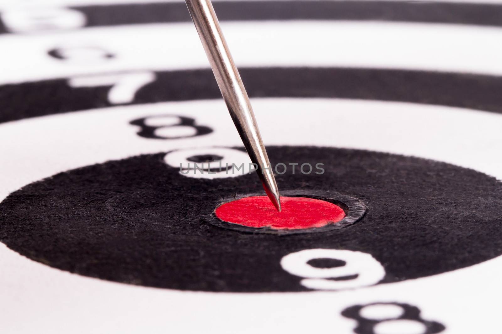 Arrow in the middle of dart board.
