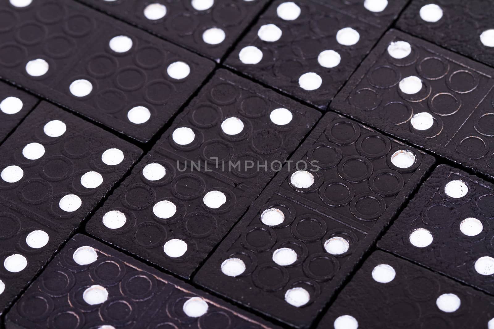 Full view of dominoes pieces in a row.