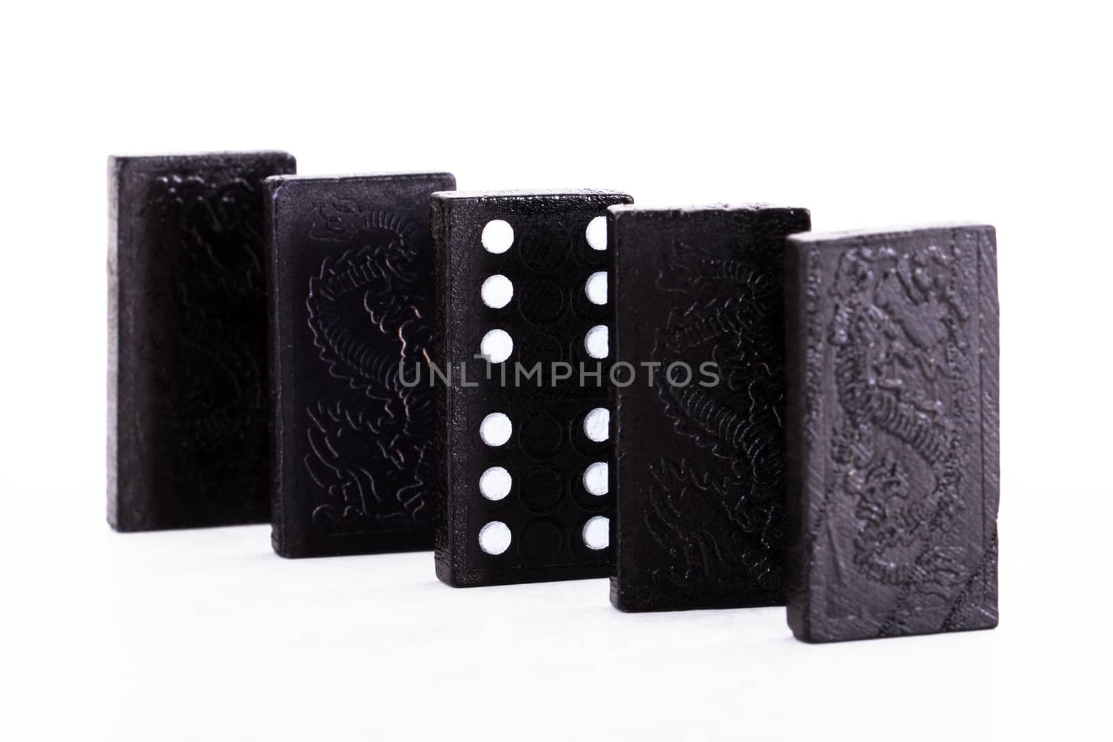 Row of dominoes, isolated on white background.