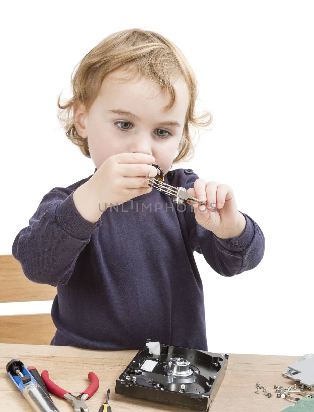 little girl repairing computer parts. studio shot isolated on white background